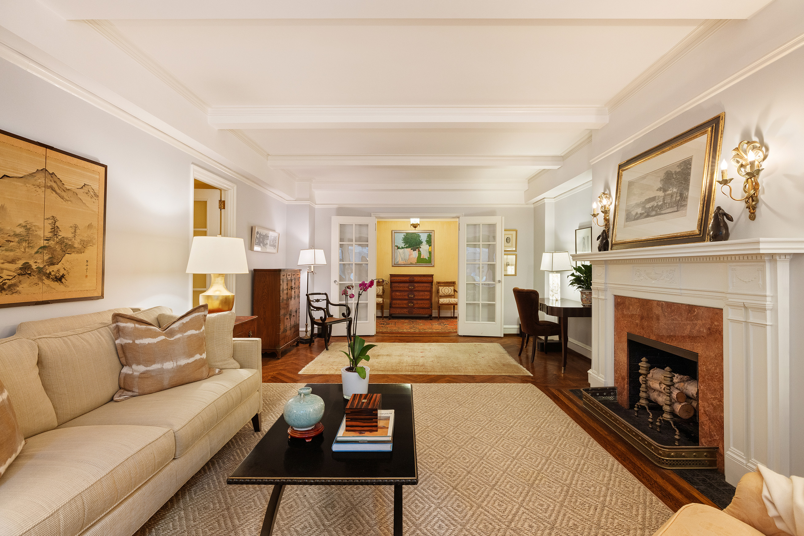 115 East 86th Street, Unit 22 Manhattan, NY 10028 - Photo 2 of 16 a living room with furniture and a fireplace