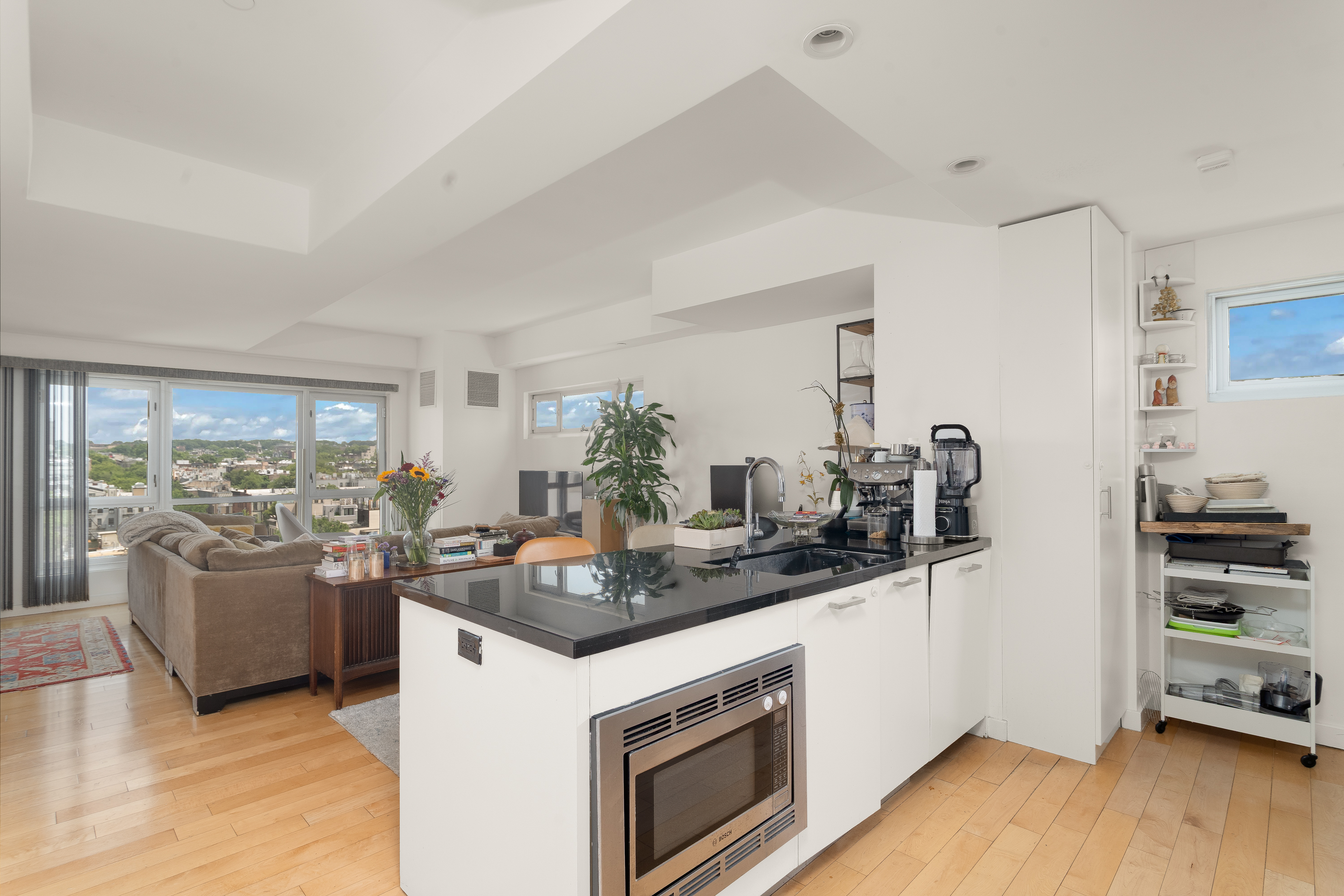 560 Carroll Street, Unit 11A Brooklyn, NY 11215 - Photo 2 of 15 a kitchen with stainless steel appliances granite countertop a stove and a refrigerator