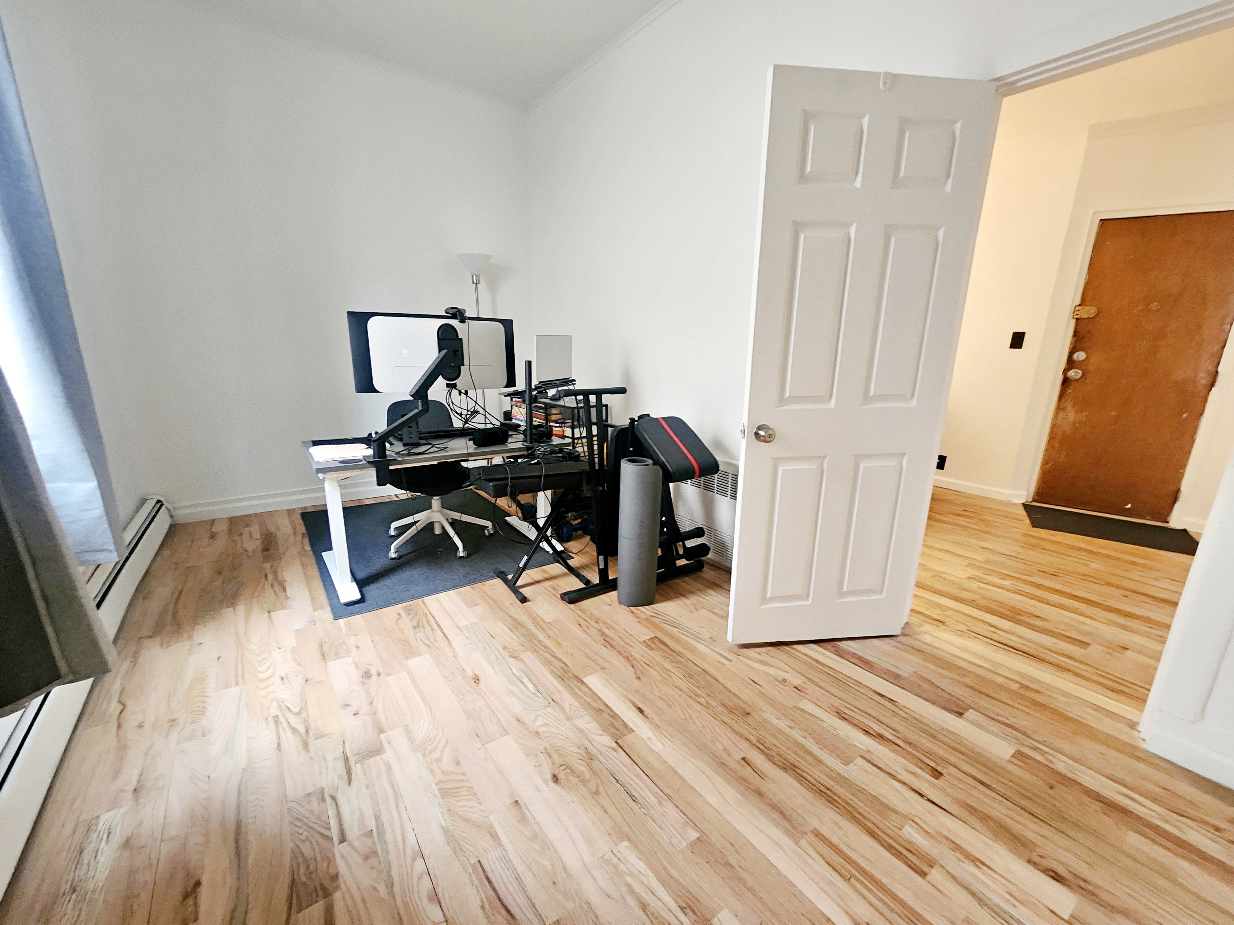 258 Devoe Street, Unit 1 Brooklyn, NY 11211 - Photo 8 of 12 a view of a workspace with wooden floor