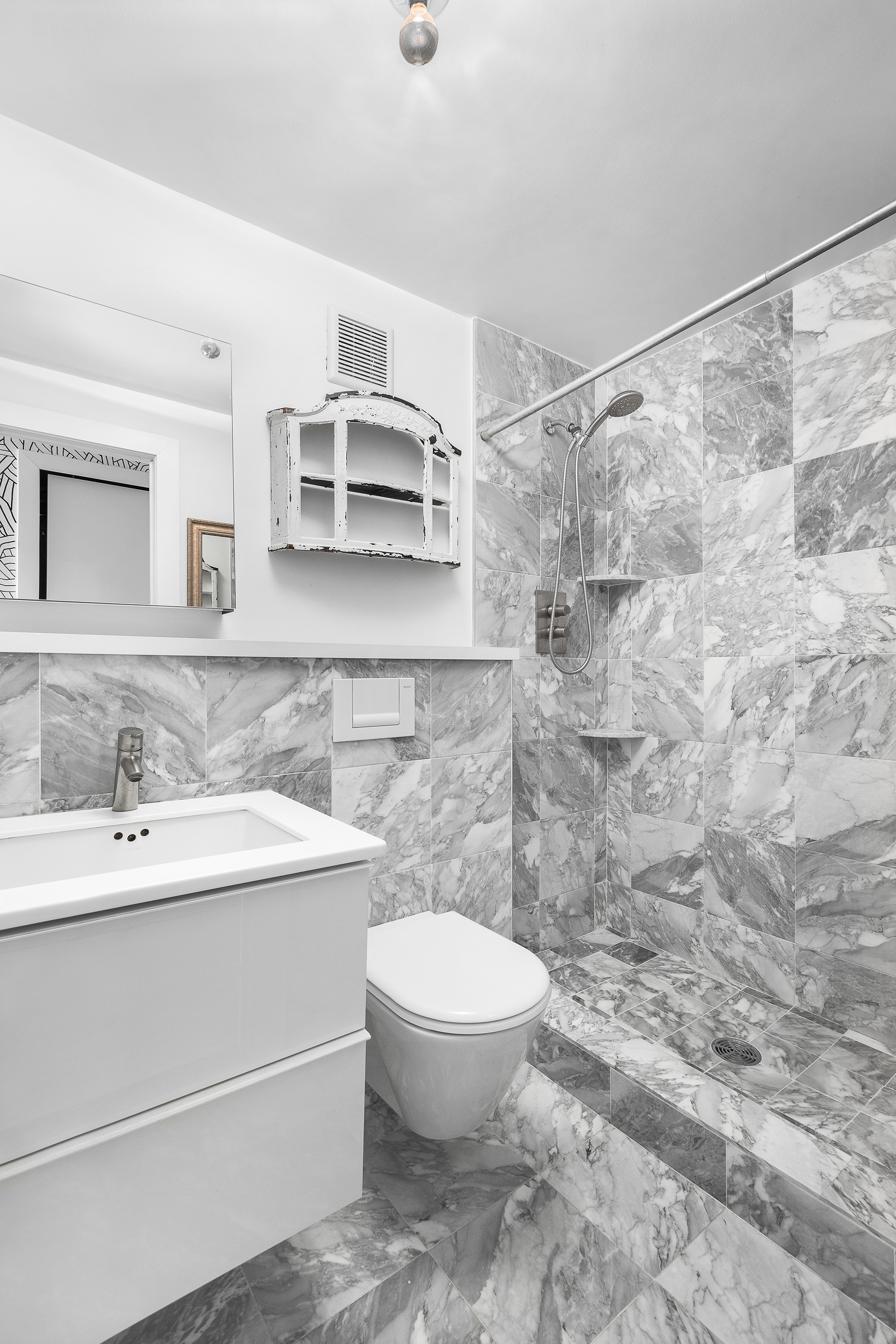 244 Madison Avenue, Unit PHE Manhattan, NY 10016 - Photo 11 of 20 a bathroom with a sink a toilet and shower