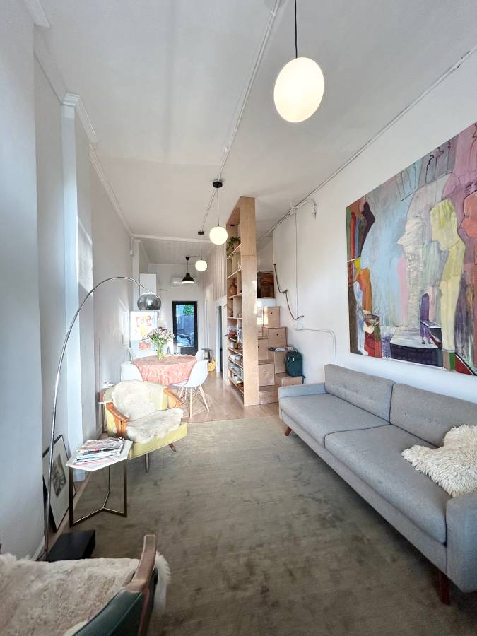 409 Smith Street, Unit 1 Brooklyn, NY 11231 - Photo 2 of 9 a living room with furniture and a chandelier