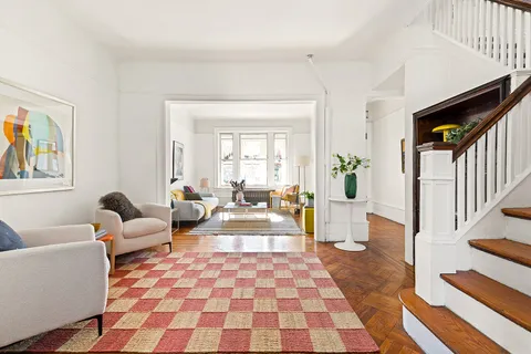 a living room with furniture and a rug
