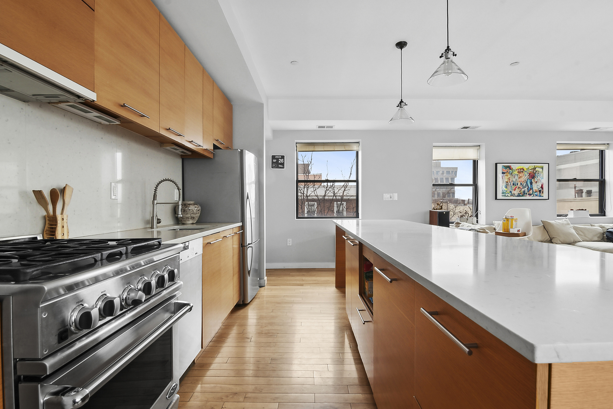 364 Manhattan Avenue, Unit 4G Brooklyn, NY 11211 - Photo 5 of 13 a large kitchen with stainless steel appliances granite countertop a lot of counter space