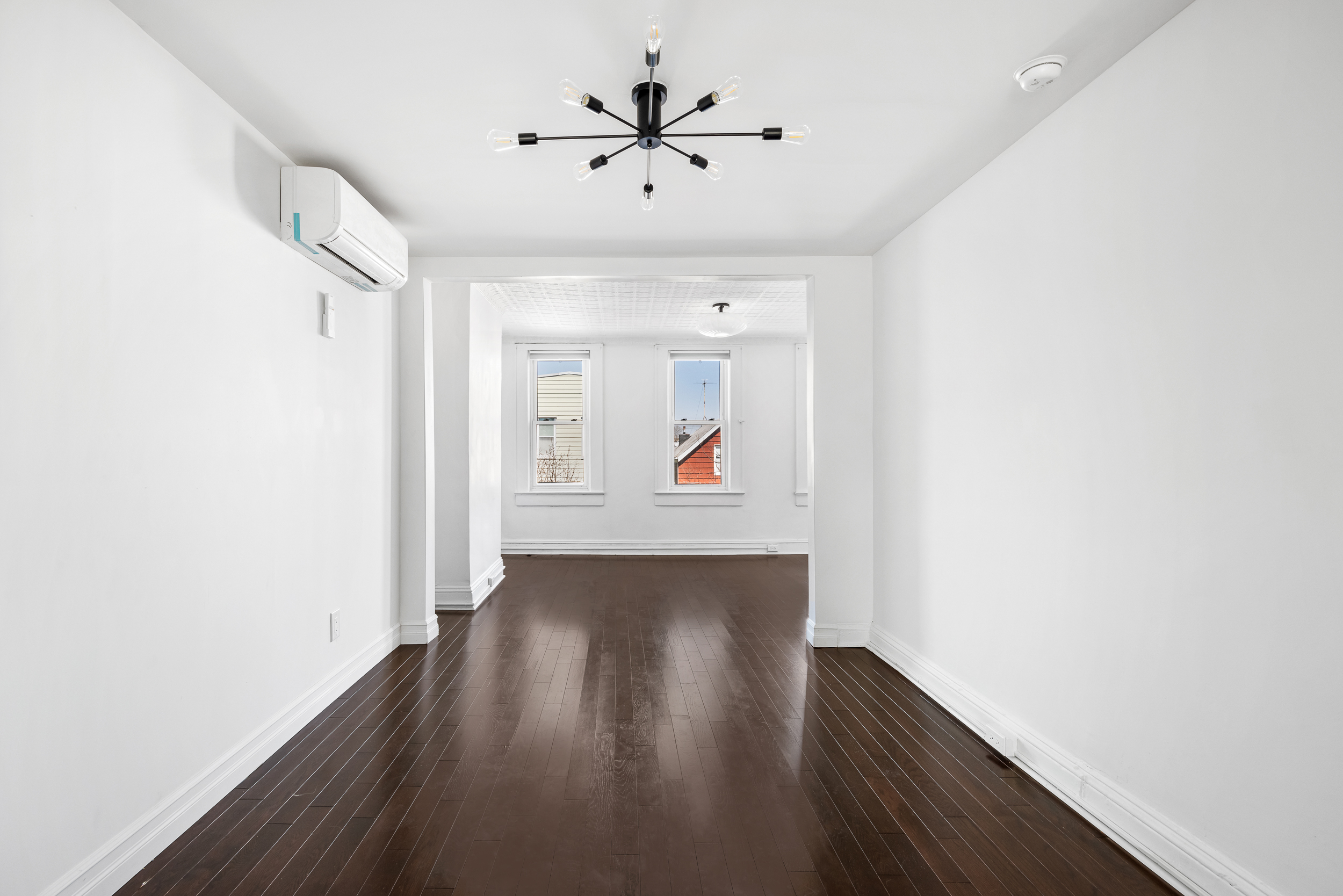 404 A 17th Street, Unit 3 Brooklyn, NY 11215 - Photo 2 of 9 wooden floor in an empty room with a window