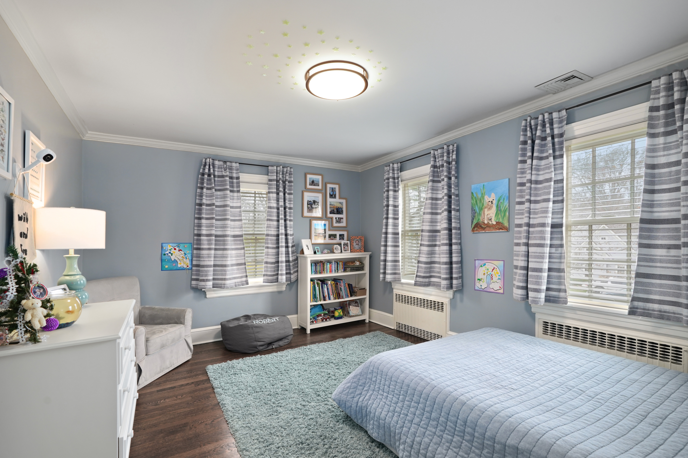 15 Anderson Road Greenwich, CT 06830 - Photo 15 of 30 a bedroom with a bed and wooden floor