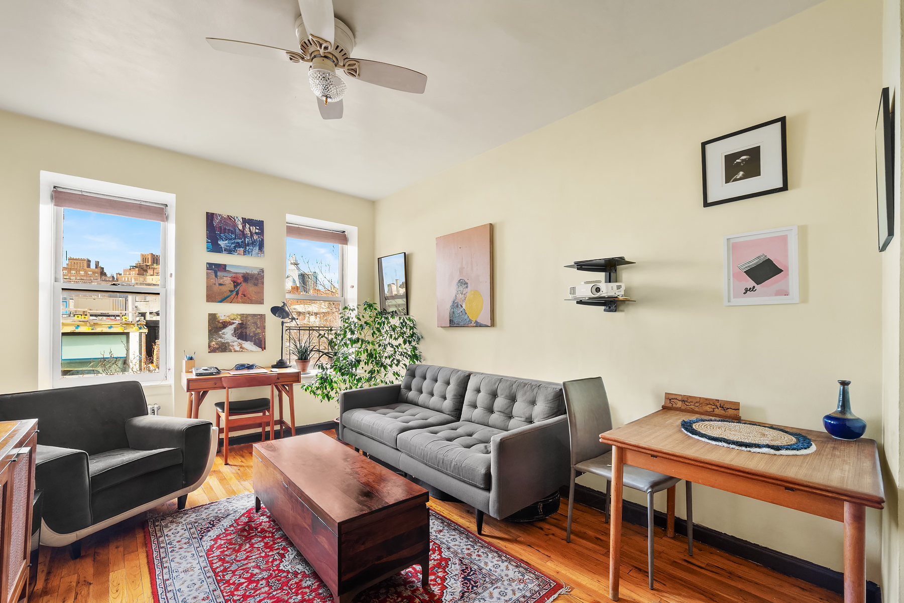 88 Charles Street, Unit 5D Manhattan, NY 10014 - Photo 4 of 11 a living room with furniture and wooden floor