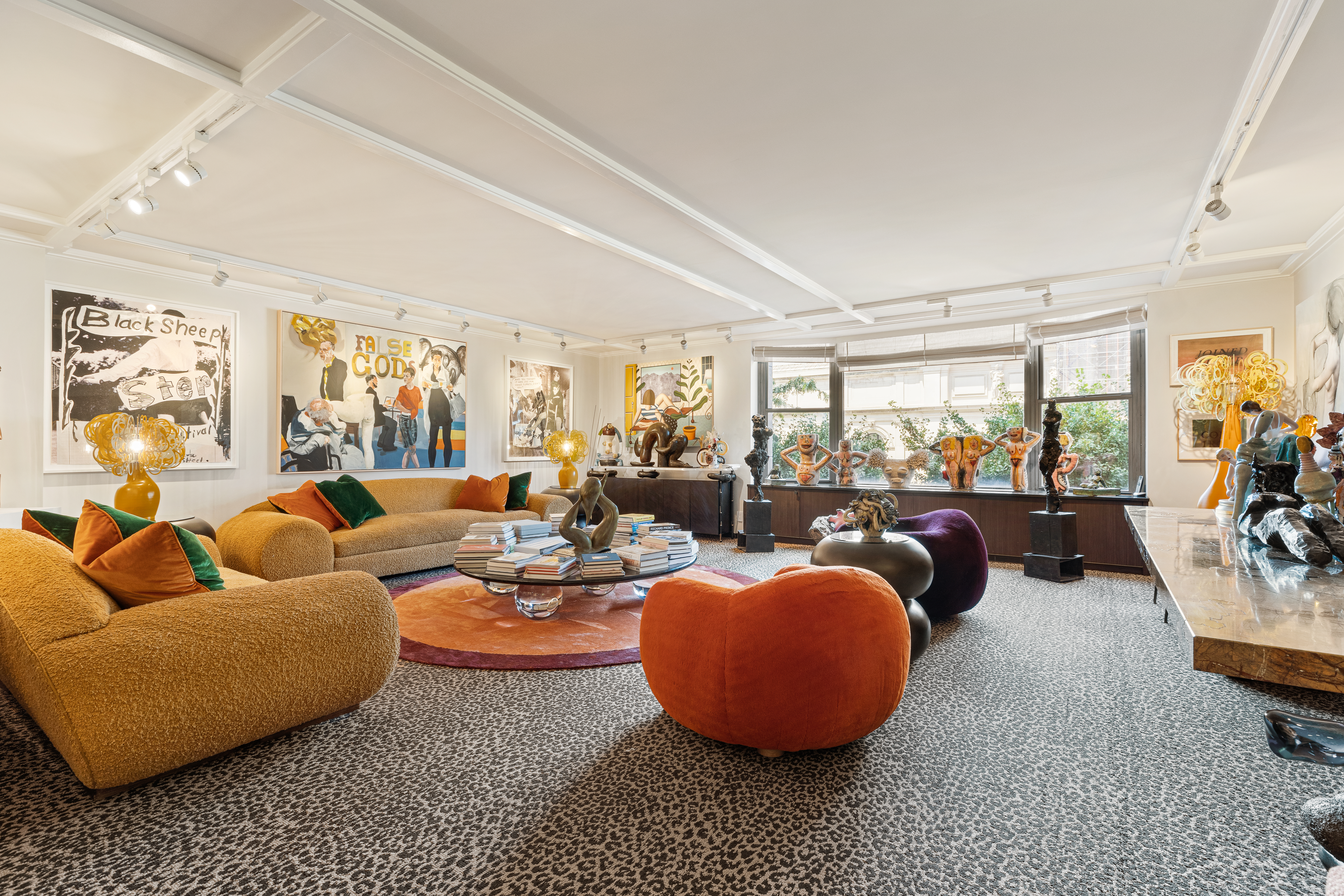 1001 5th Avenue, Unit 4C Manhattan, NY 10028 - Photo 2 of 11 a living room with furniture a rug and a large window