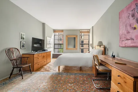 a bedroom with a bed and furniture