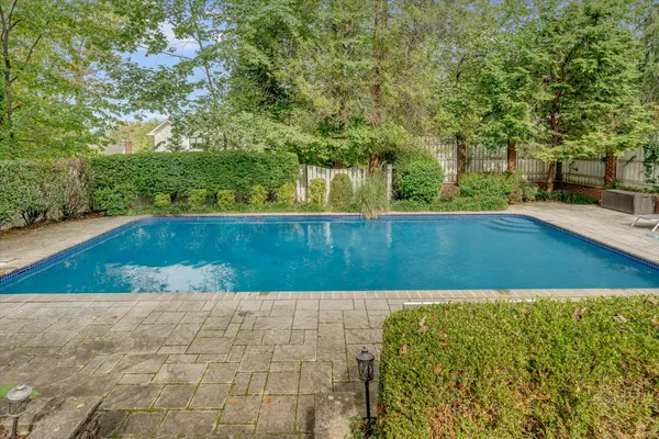 a view of swimming pool with a yard