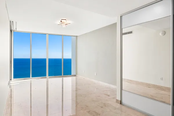 a spacious bathroom with a tub sink shower and mirror