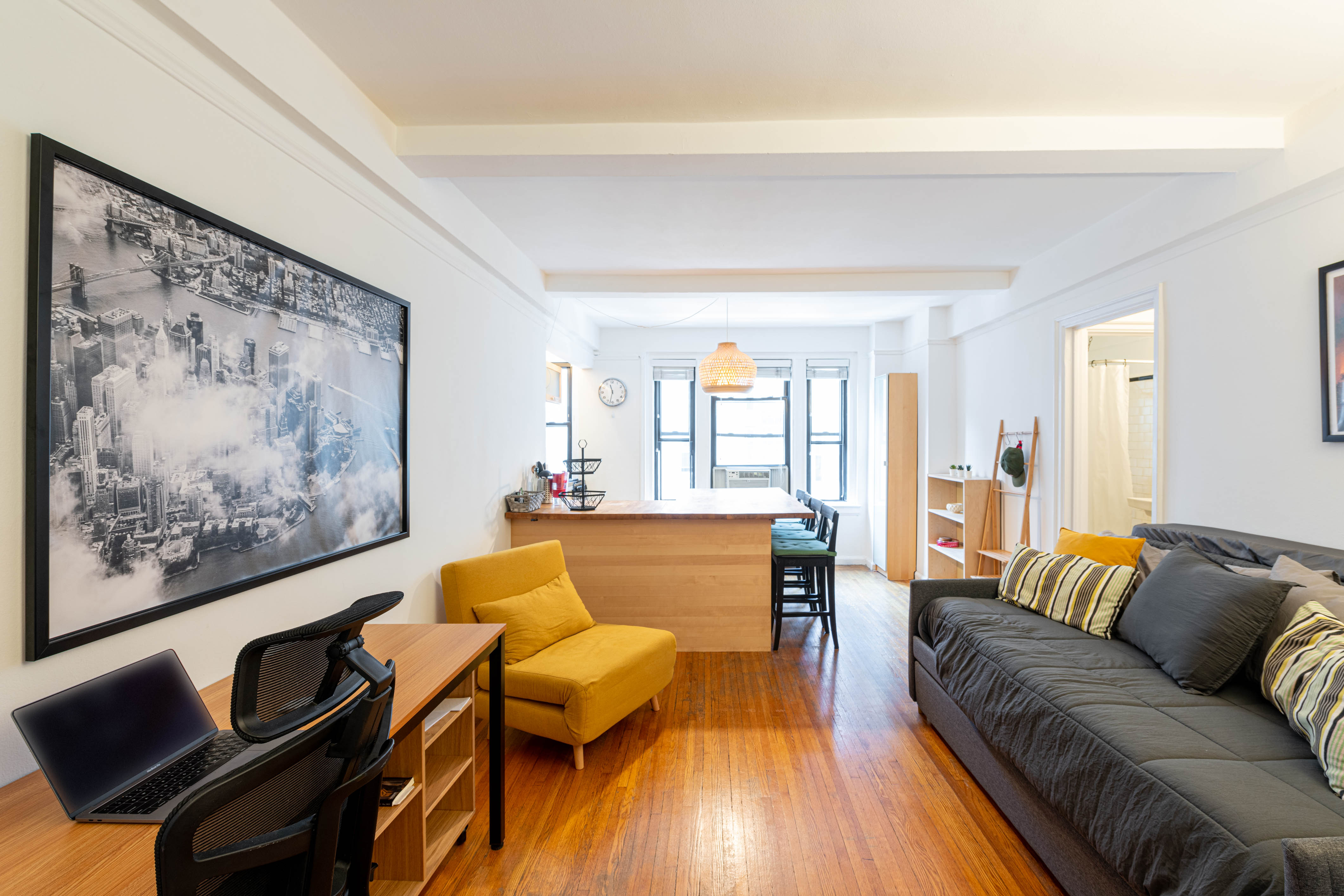 339 East 58th Street, Unit 5B Manhattan, NY 10022 - Photo 2 of 13 a living room with furniture and wooden floor