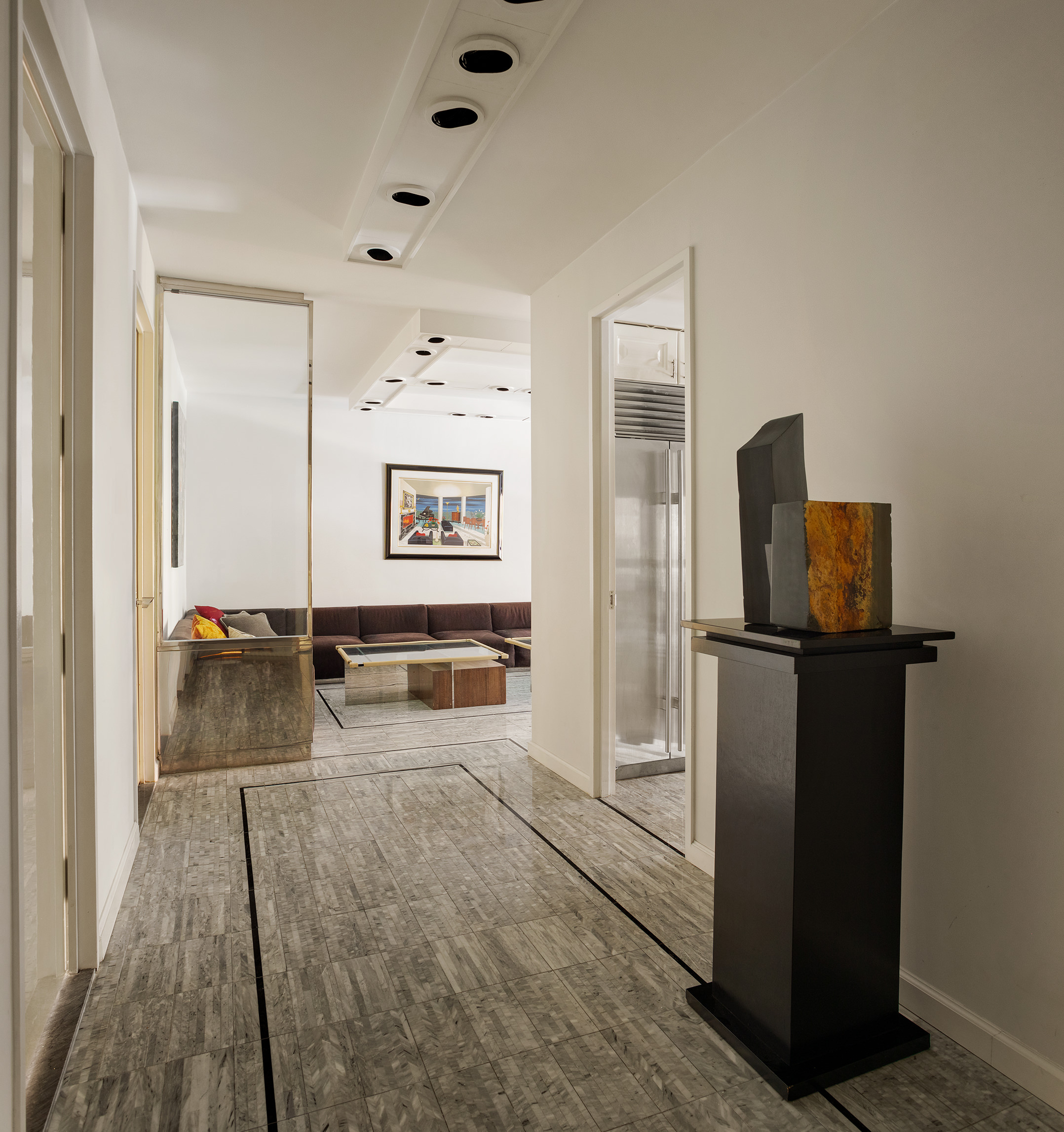 415 East 54th Street, Unit 2A Manhattan, NY 10022 - Photo 3 of 16 a room with a refrigerator and television