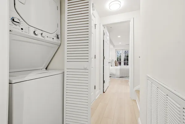 a bedroom with a bed and a night stand