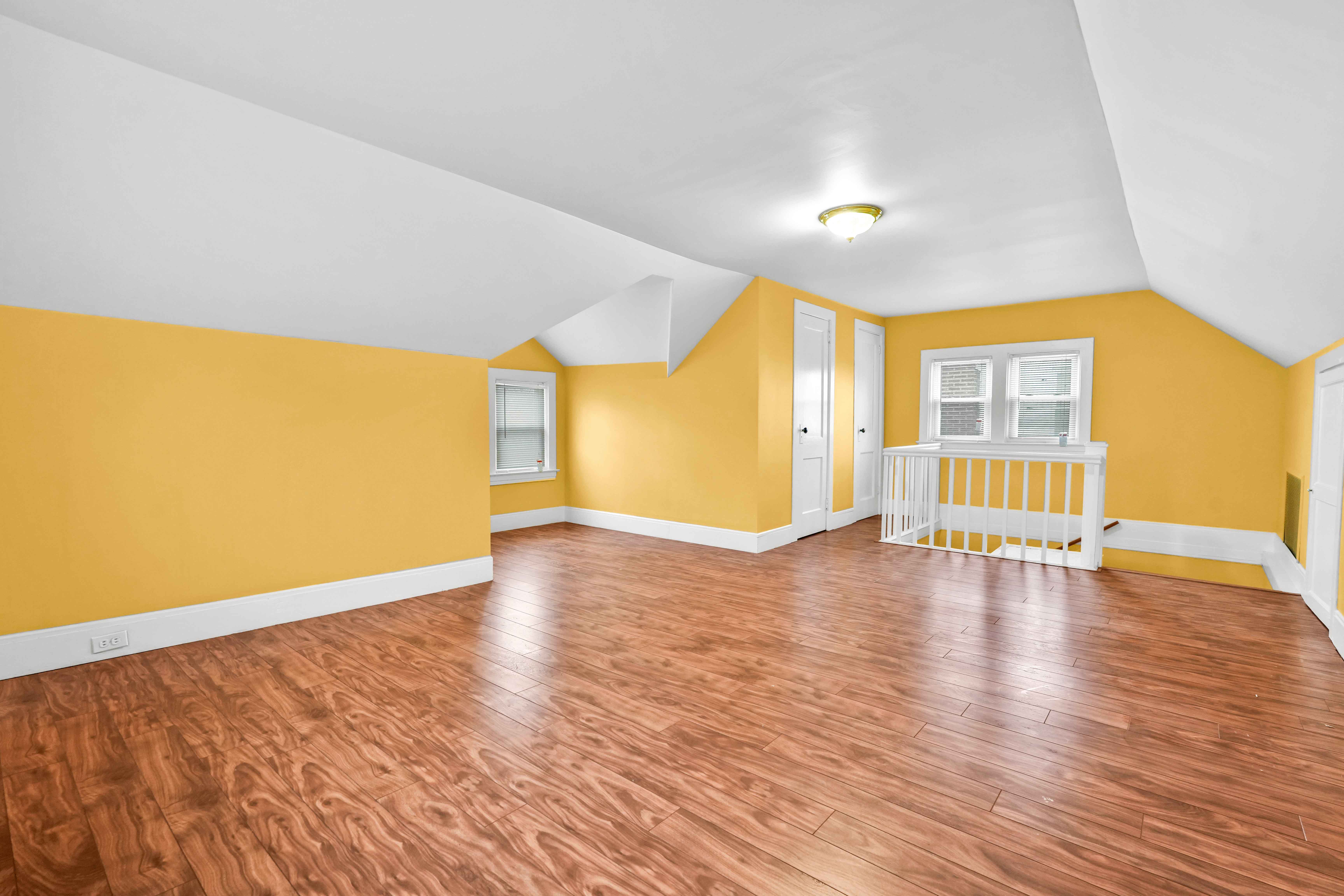 188-22 Lewiston Avenue, Unit 1 Queens, NY 11412 - Photo 16 of 17 a view of an empty room with window and wooden floor