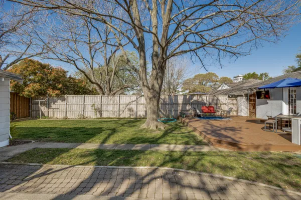 a view of a park with large trees