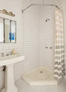 a bathroom with a shower and a sink