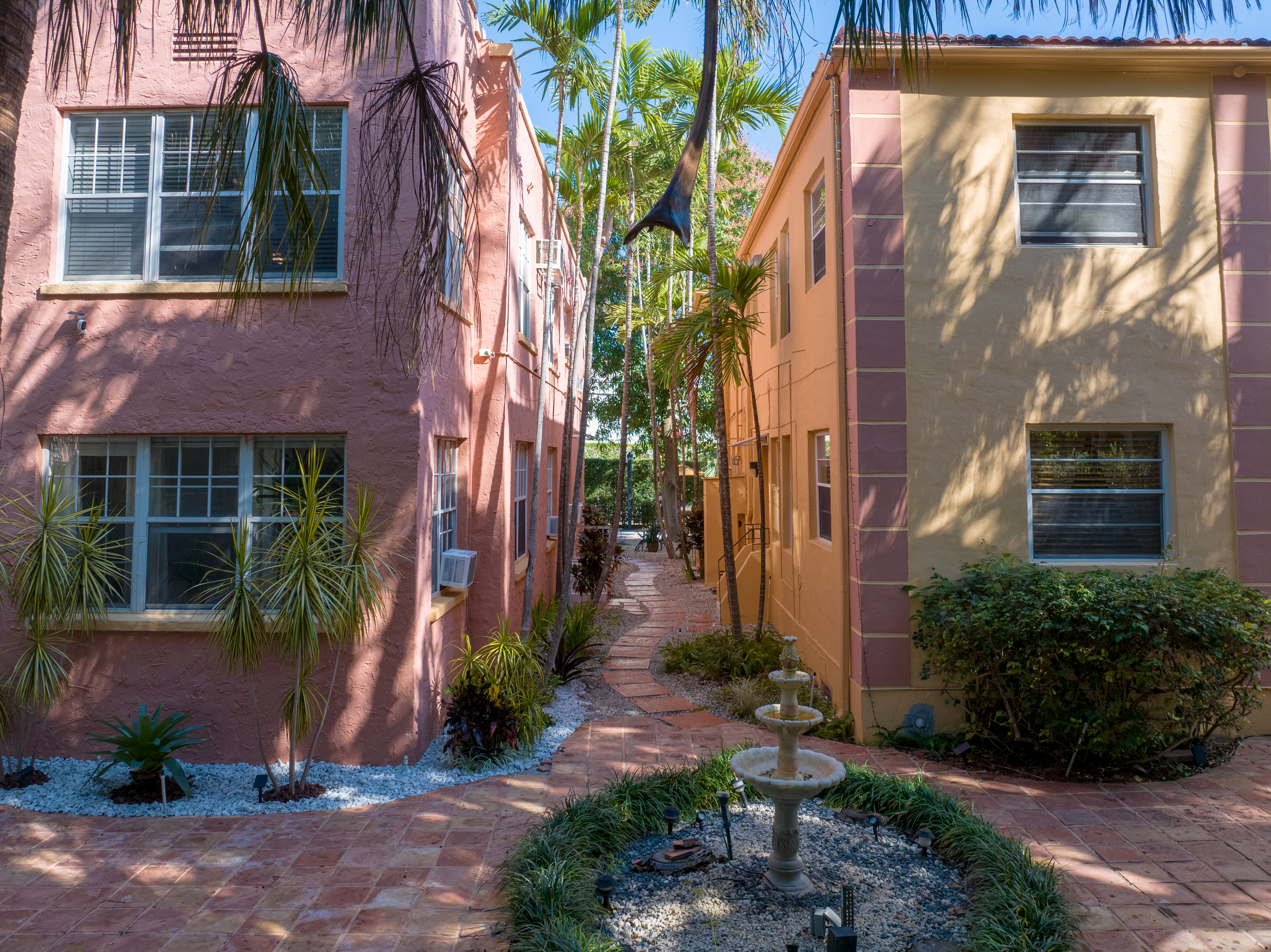 735-745 Meridian Avenue Miami Beach, FL 33139 - Photo 57 of 62 a view of a building with a yard and potted plants
