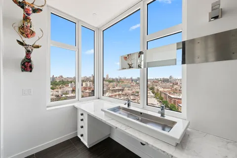 a room with view of wooden floor and window
