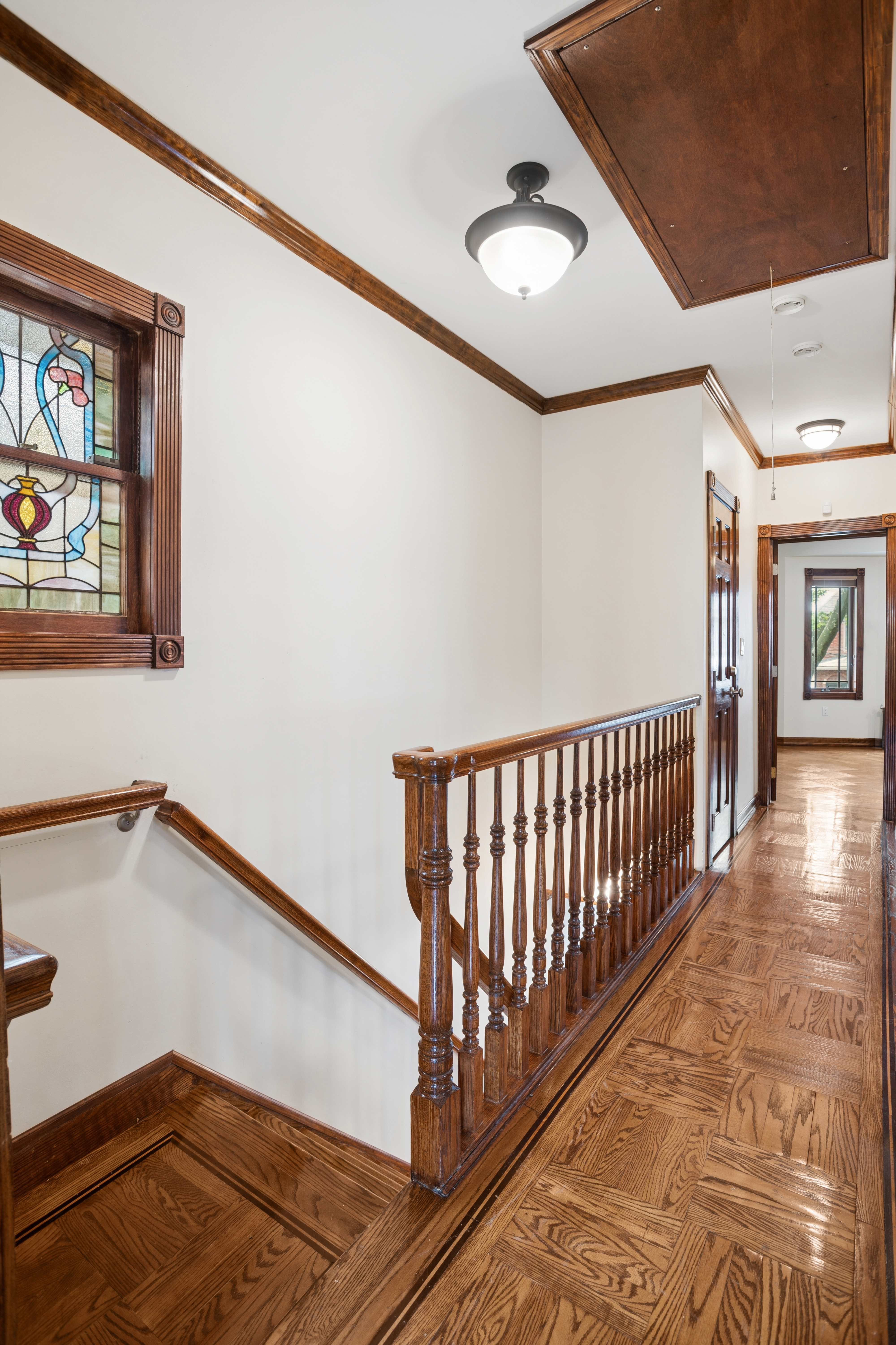 1982 East 23rd Street Brooklyn, NY 11229 - Photo 9 of 16 a view of a hallway with window and stairs