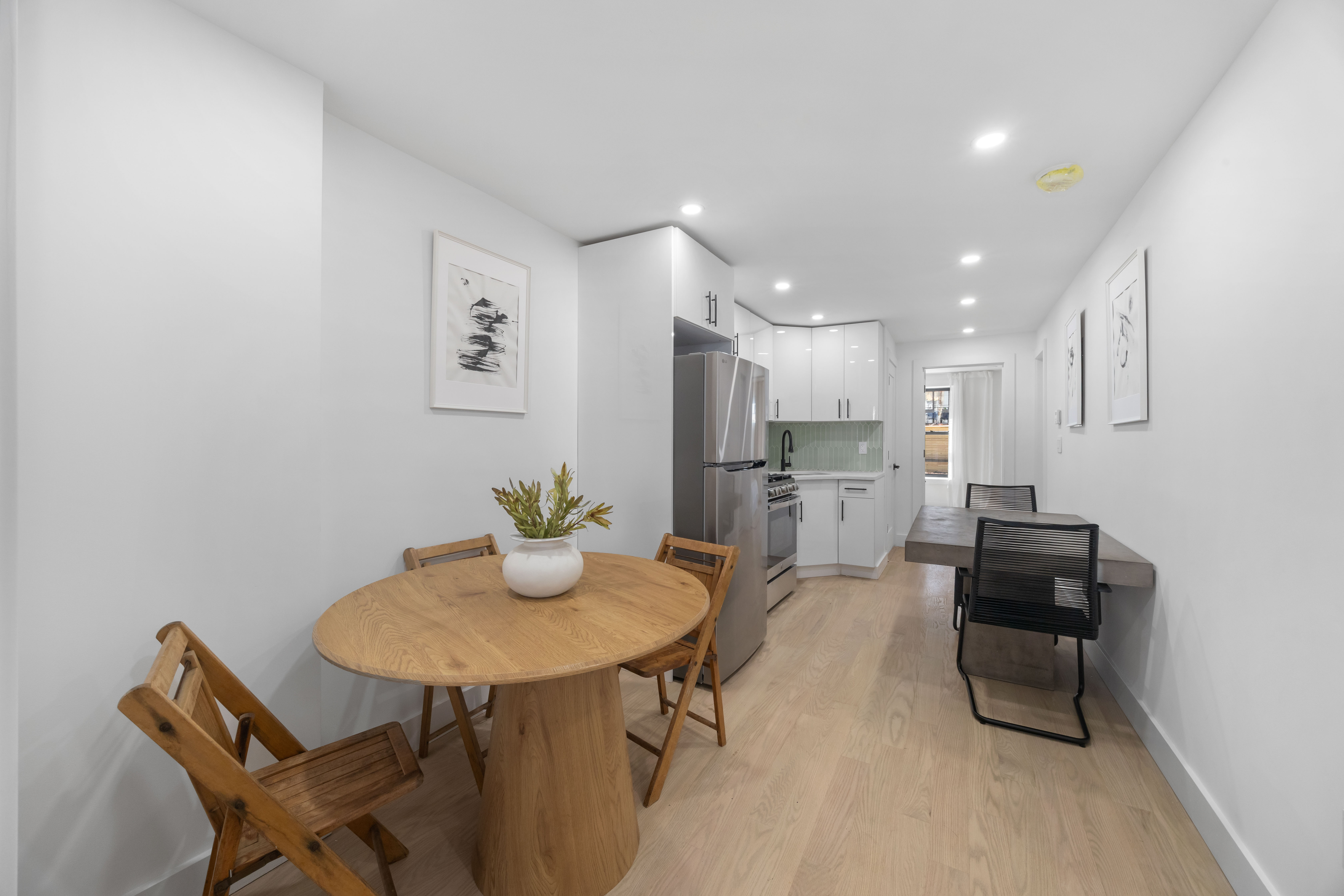 1000 Putnam Avenue Brooklyn, NY 11221 - Photo 13 of 17 a kitchen with a table and chairs in it