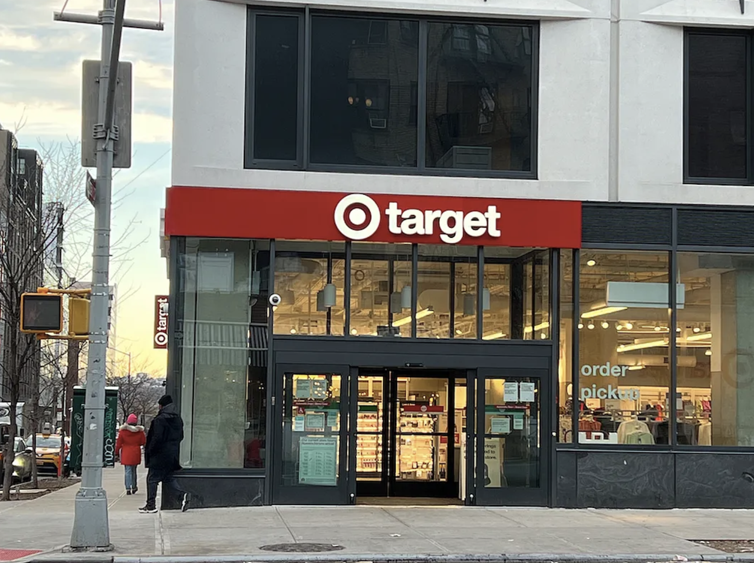 446 West 46th Street, Unit 12 Manhattan, NY 10036 - Photo 16 of 18 a view of a brick building with a red door and a window