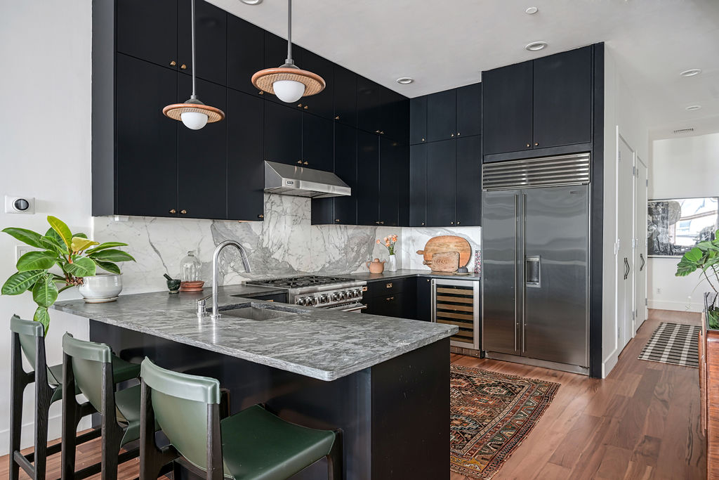 42 East 12th Street, Unit 2 Manhattan, NY 10003 - Photo 5 of 18 a kitchen with a table chairs and refrigerator