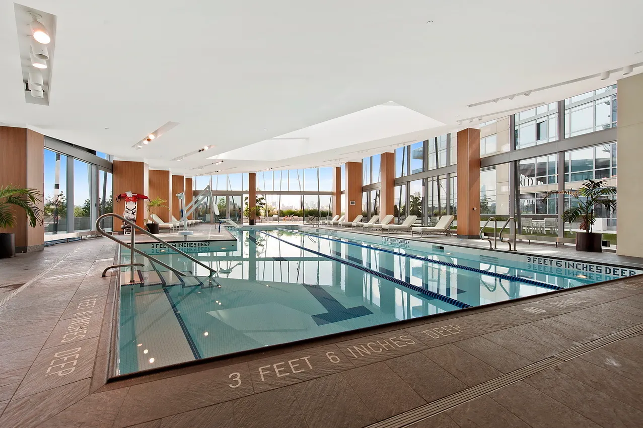 a view of swimming pool with outdoor seating