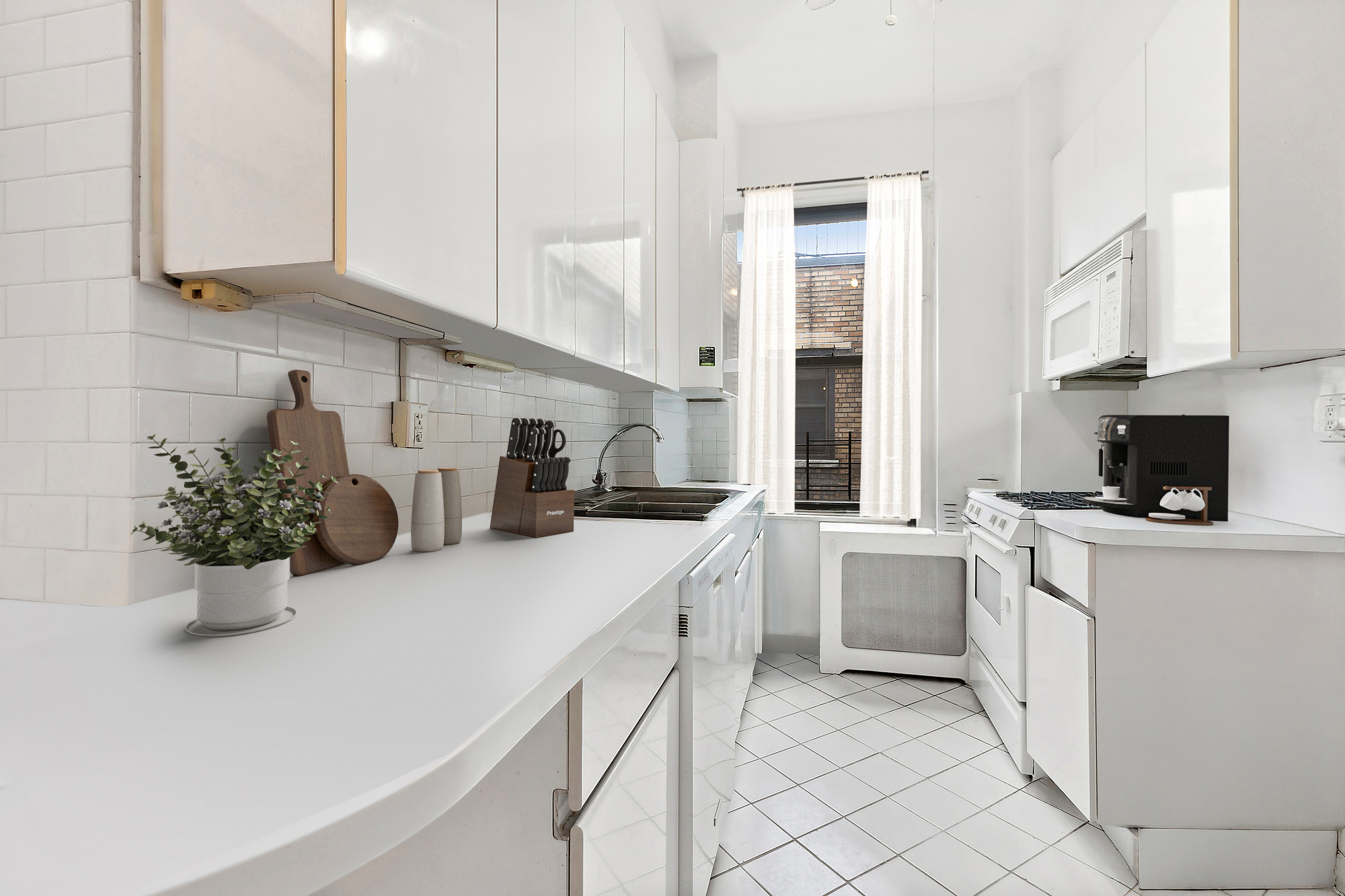 215 West 92nd Street, Unit 15A Manhattan, NY 10025 - Photo 5 of 14 a kitchen with sink and cabinets