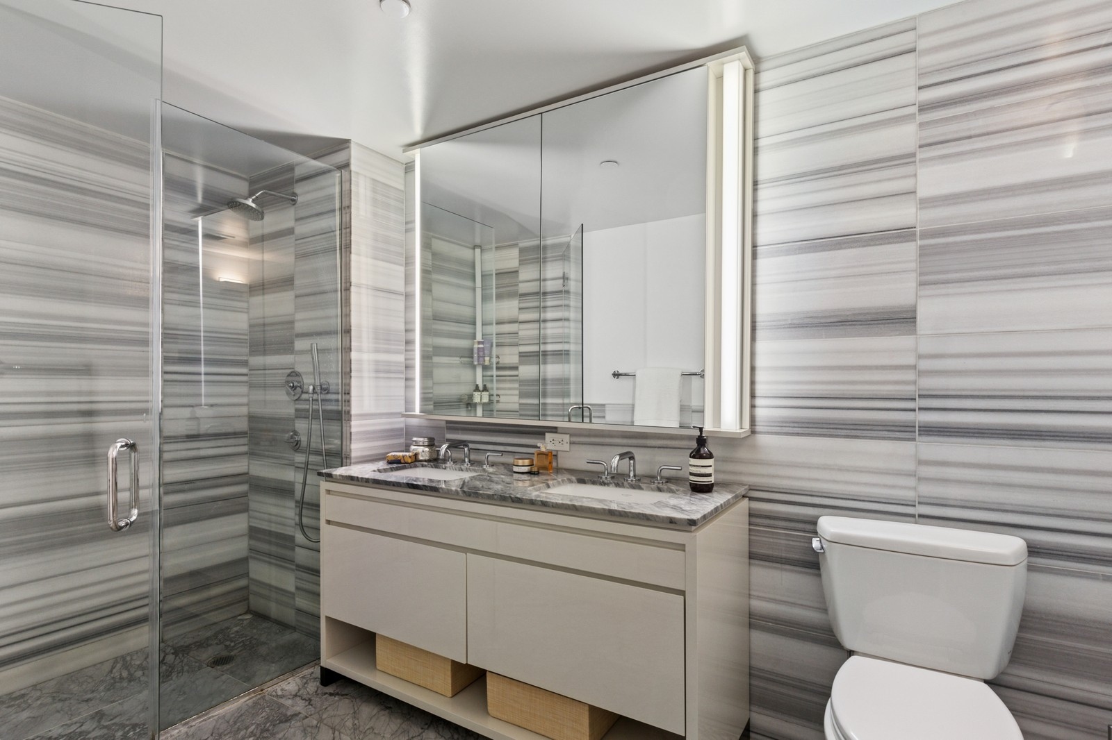 385 1st Avenue, Unit 6B Manhattan, NY 10010 - Photo 7 of 15 a bathroom with a granite countertop sink toilet and shower