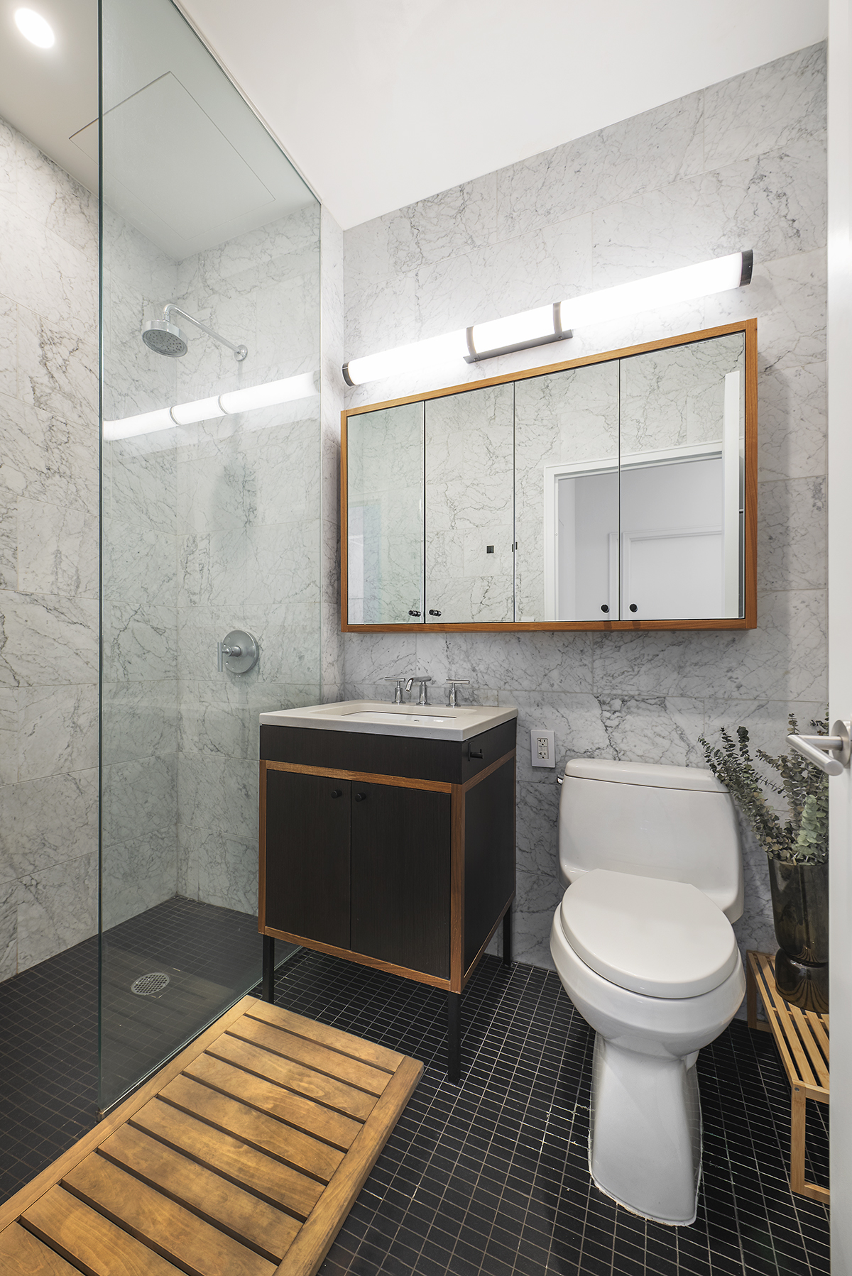 184 Kent Avenue, Unit D519 Brooklyn, NY 11249 - Photo 9 of 17 a bathroom with a sink and a toilet