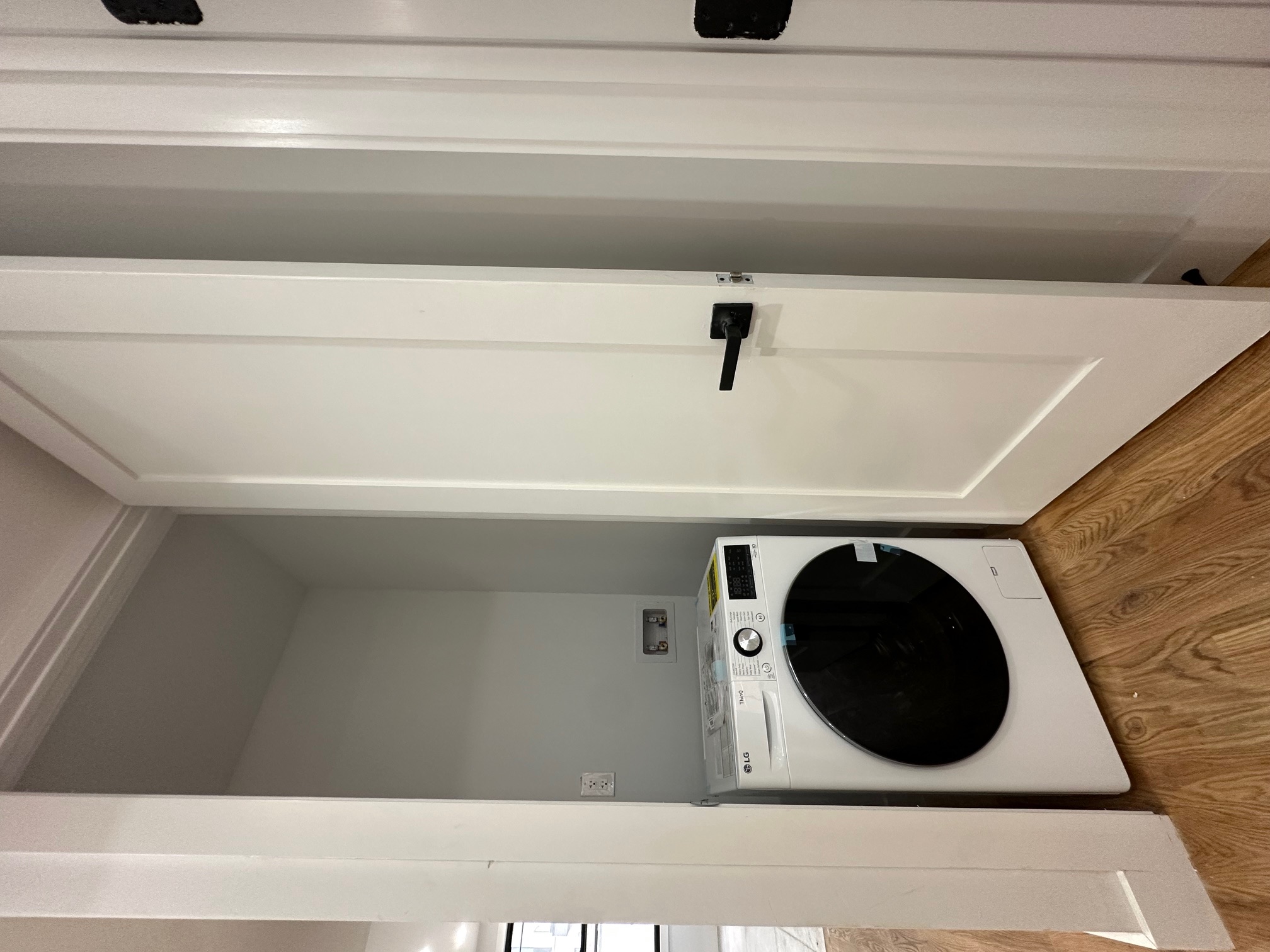 38-18 32nd Street, Unit 1 Queens, NY 11101 - Photo 6 of 6 a view of a hallway with washer and dryer