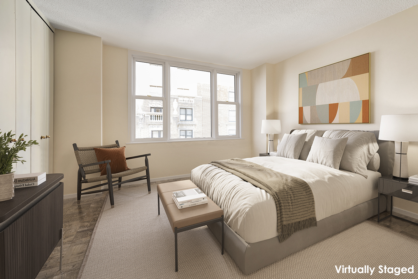 137 East 36th Street, Unit 12G Manhattan, NY 10016 - Photo 6 of 15 a bedroom with a bed and a couch