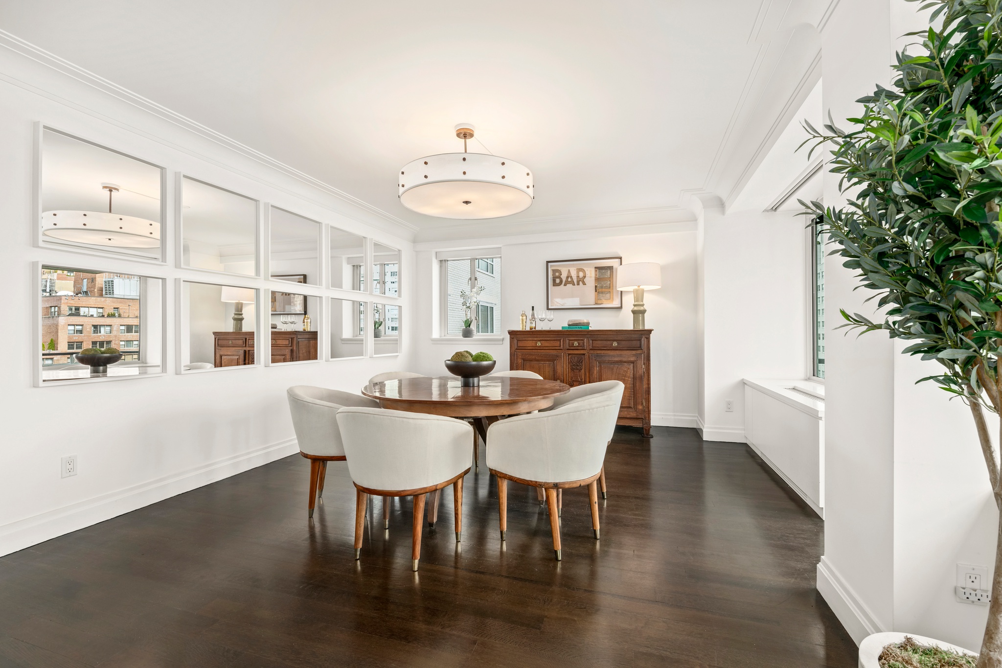 200 East 66th Street, Unit D1205 Manhattan, NY 10065 - Photo 3 of 33 a view of a dining room with furniture window and wooden floor