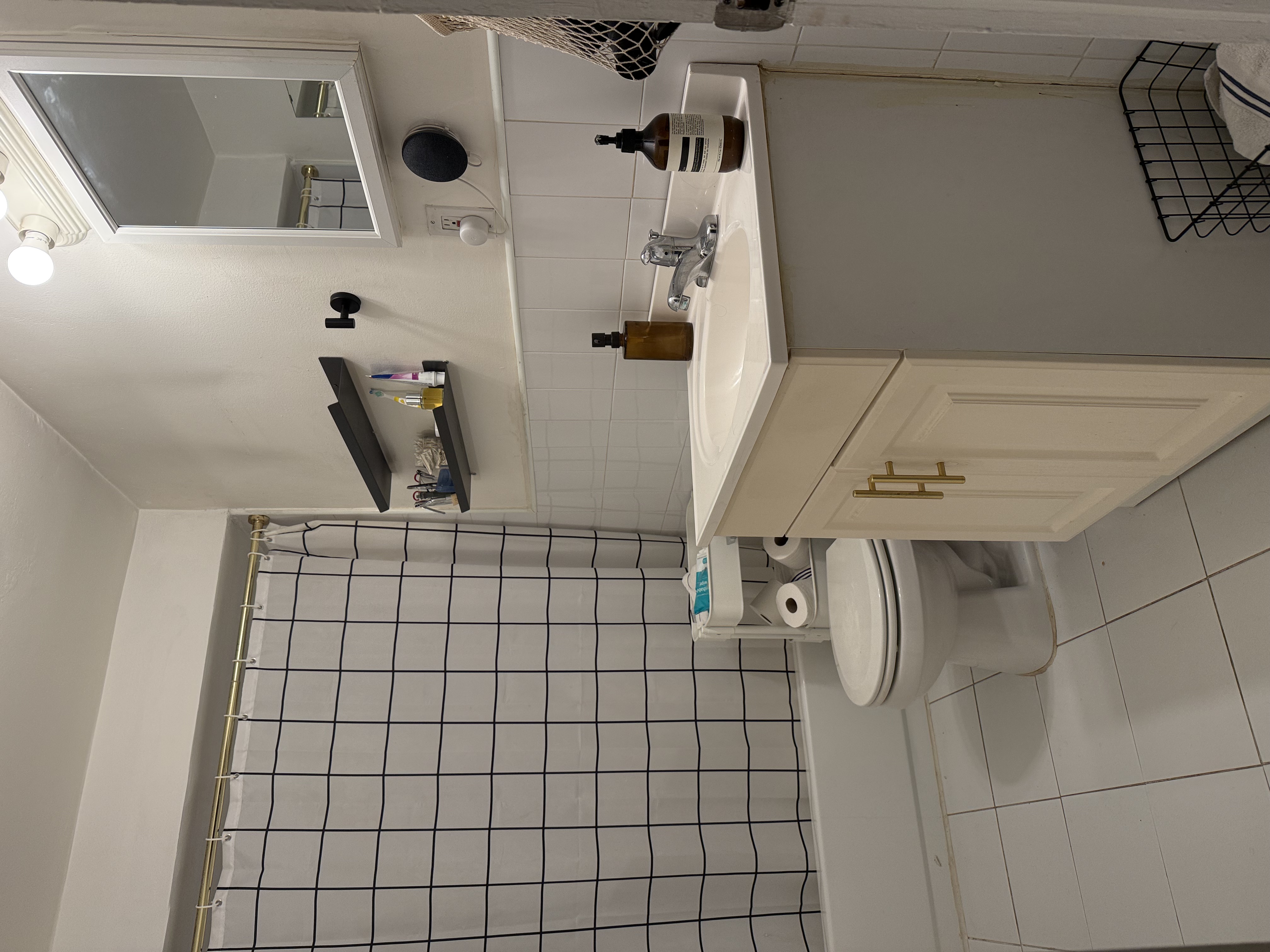 Address Upon Request Manhattan, NY 10029 - Photo 10 of 11 a bathroom with a sink mirror vanity and toilet