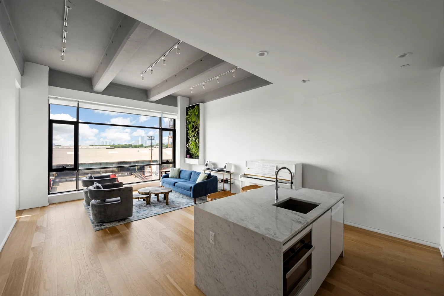 a kitchen with sink cabinets and wooden floor