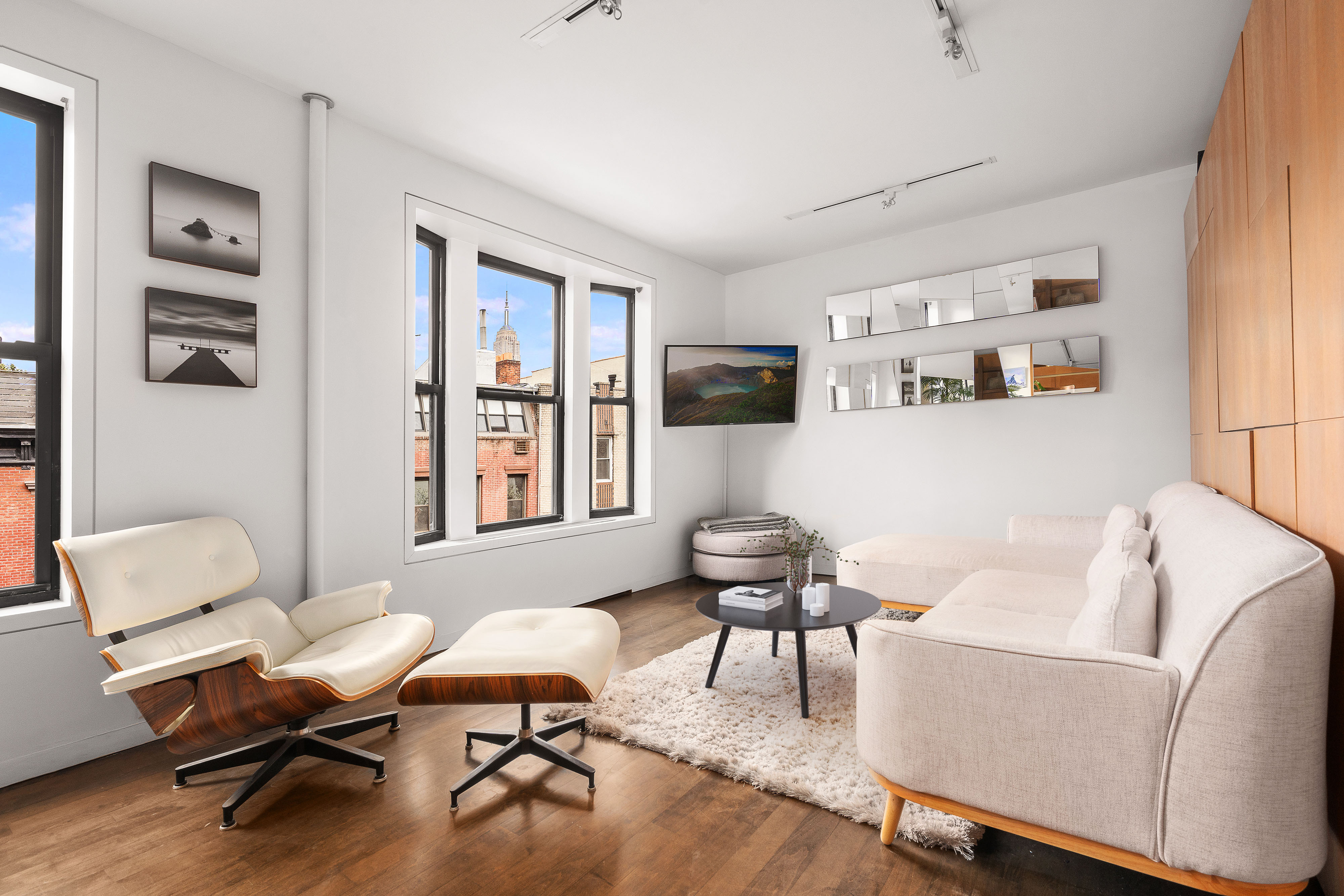 340 West 19th Street, Unit 14 Manhattan, NY 10011 - Photo 4 of 12 a living room with furniture window and wooden floor