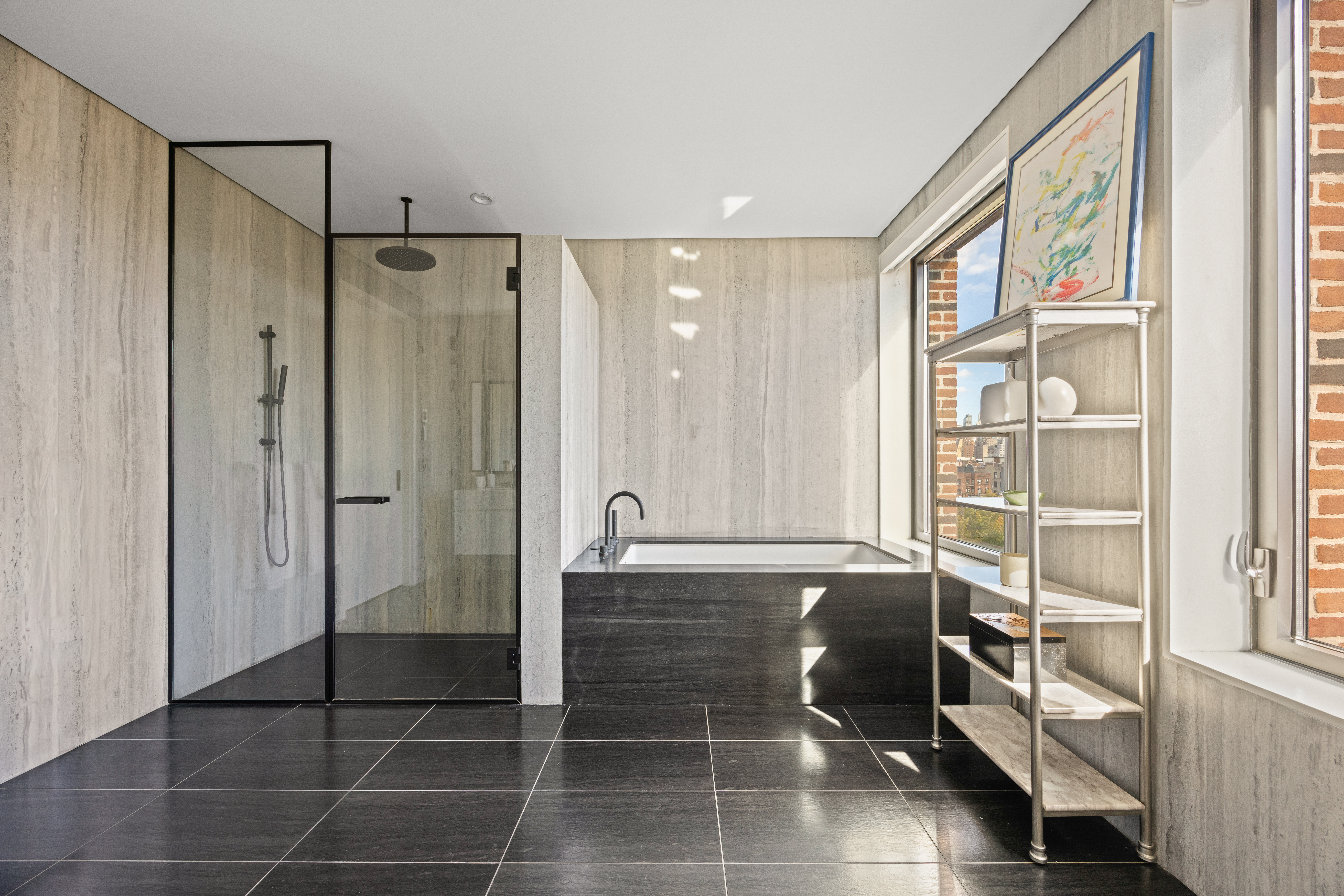 100 Barrow Street, Unit 9A Manhattan, NY 10014 - Photo 9 of 12 a bathroom with a glass shower door and a sink