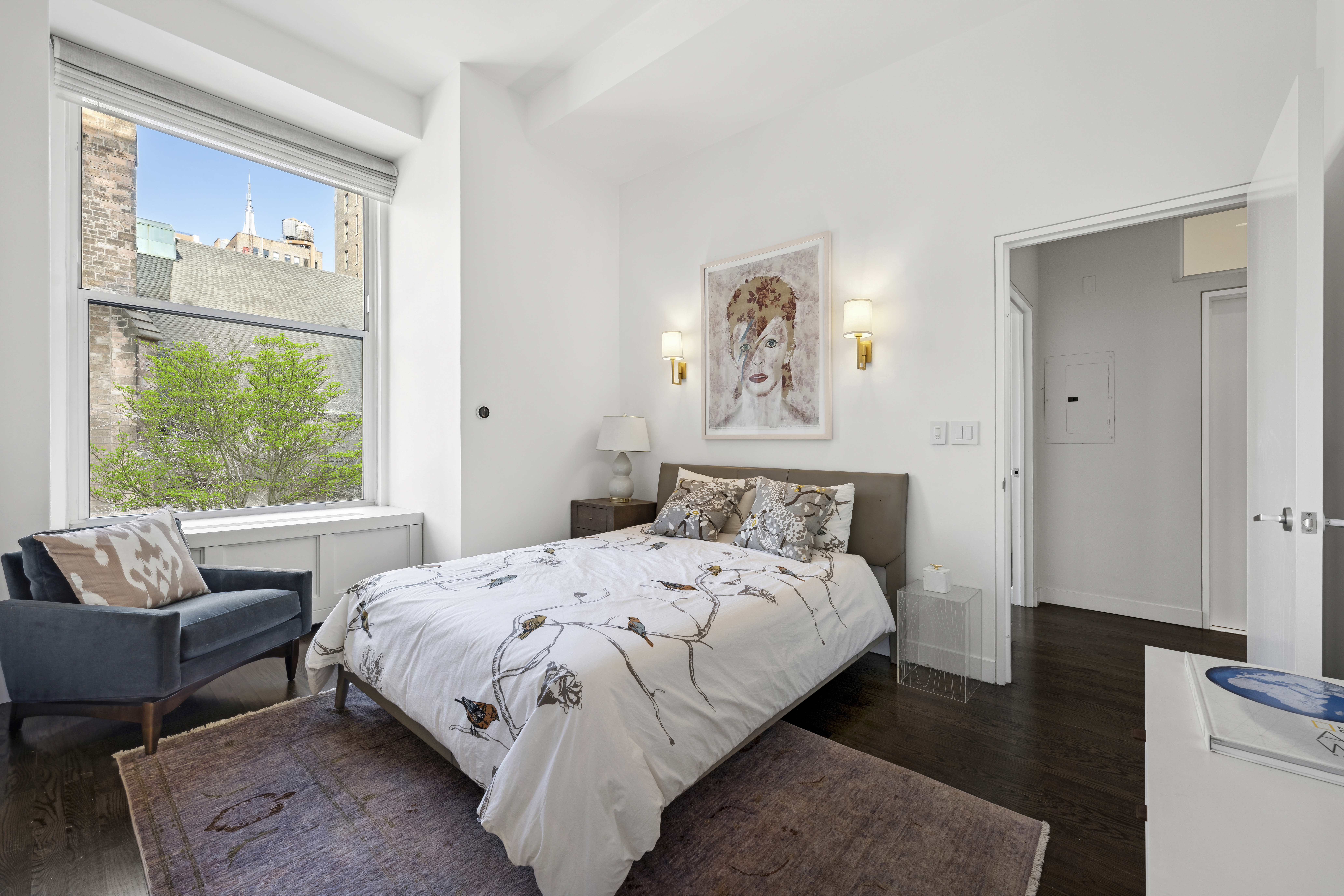 60 West 20th Street, Unit 2F Manhattan, NY 10011 - Photo 13 of 21 a bedroom with a bed and a couch
