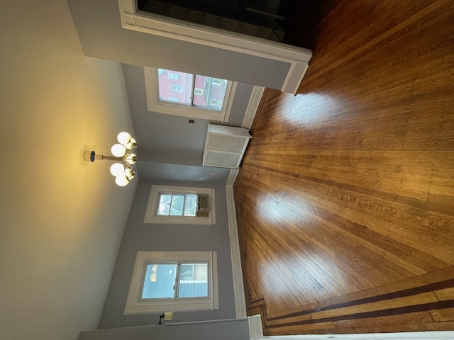 340 Marlborough Road Brooklyn, NY 11226 - Photo 20 of 27 a view of a livingroom with wooden floor and a ceiling fan