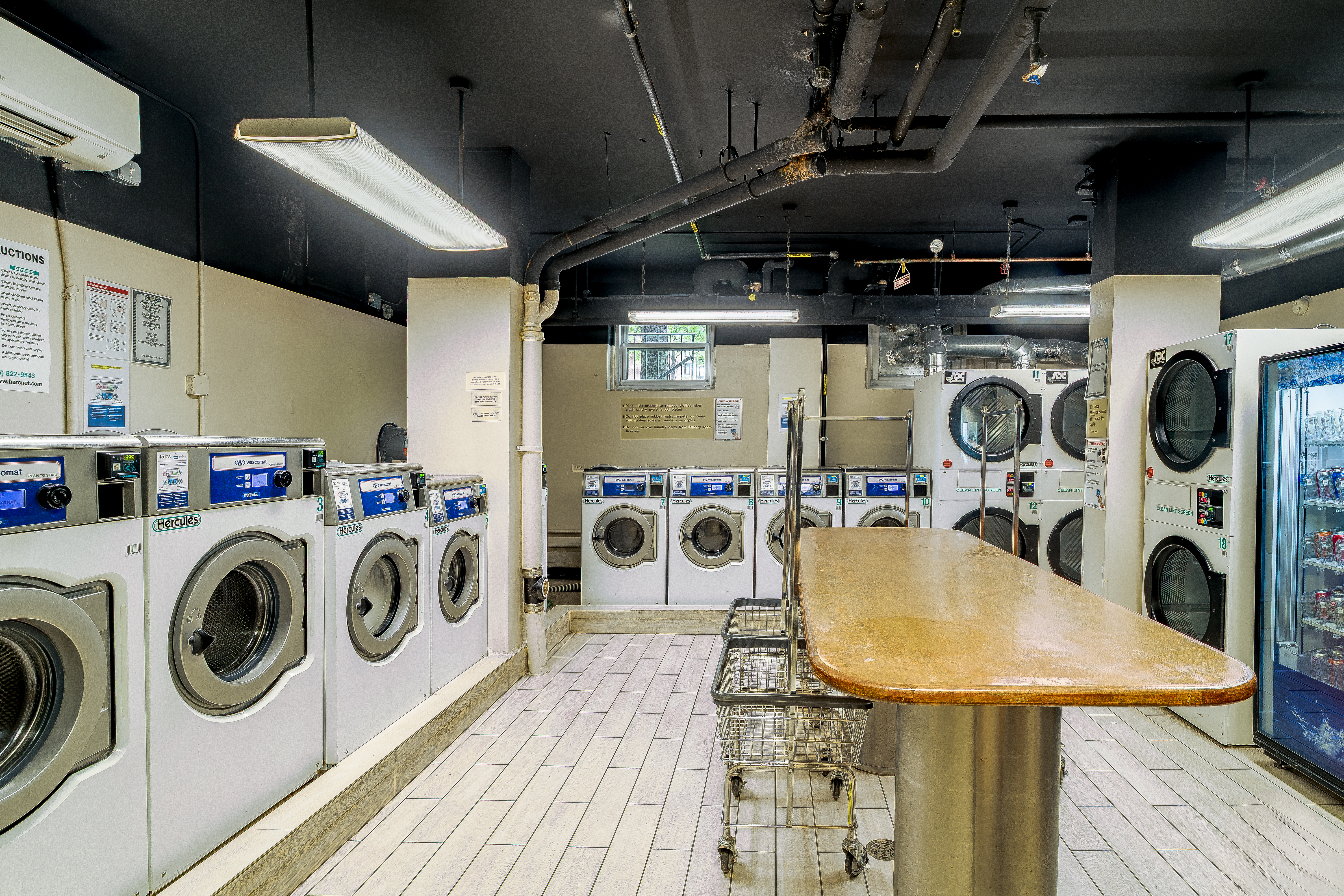191 Willoughby Street, Unit 12J Brooklyn, NY 11201 - Photo 16 of 19 a utility room with dryer washer and dryer