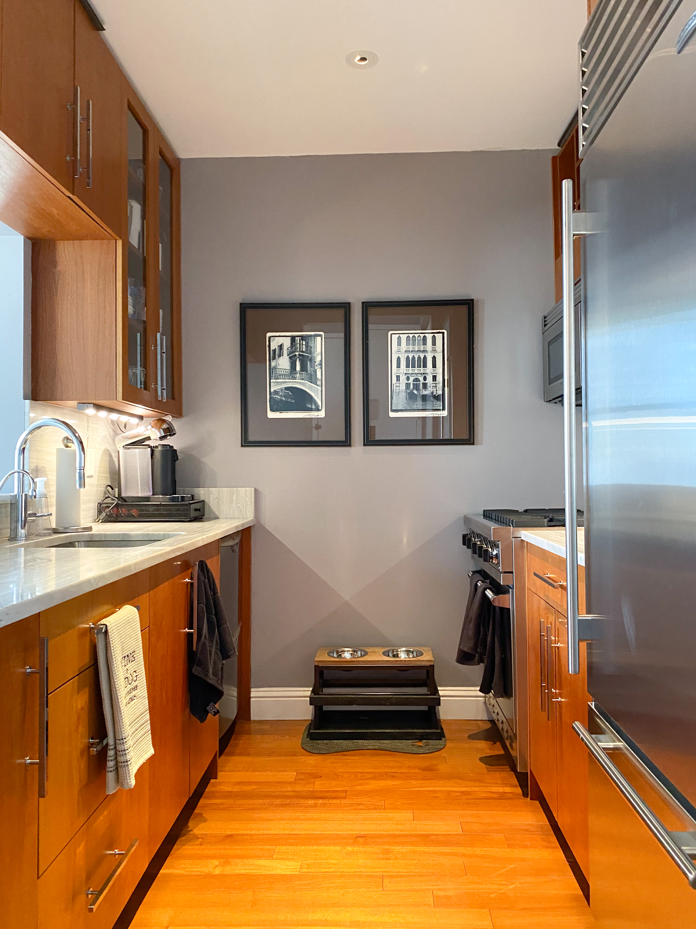 88 Greenwich Street, Unit 3005 Manhattan, NY 10006 - Photo 2 of 7 a kitchen with a refrigerator and a stove top oven