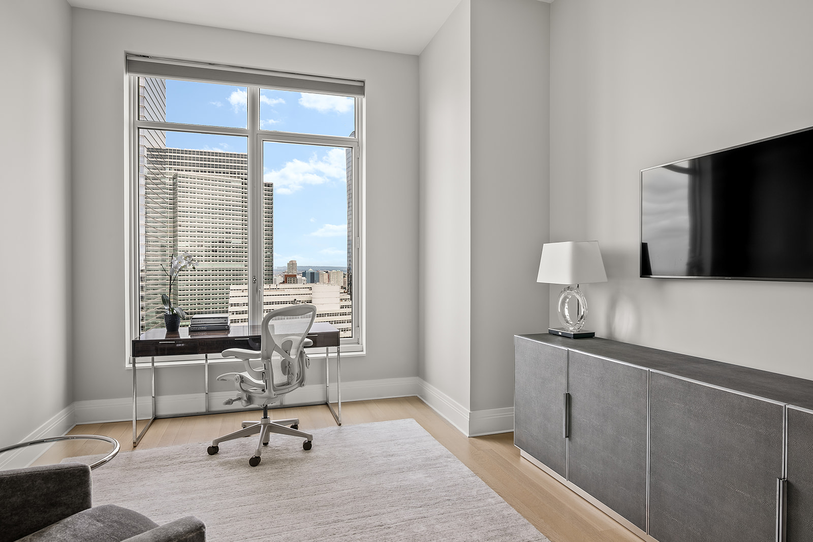 30 Park Place, Unit 43A Manhattan, NY 10007 - Photo 10 of 13 a workspace with wooden floor and a window