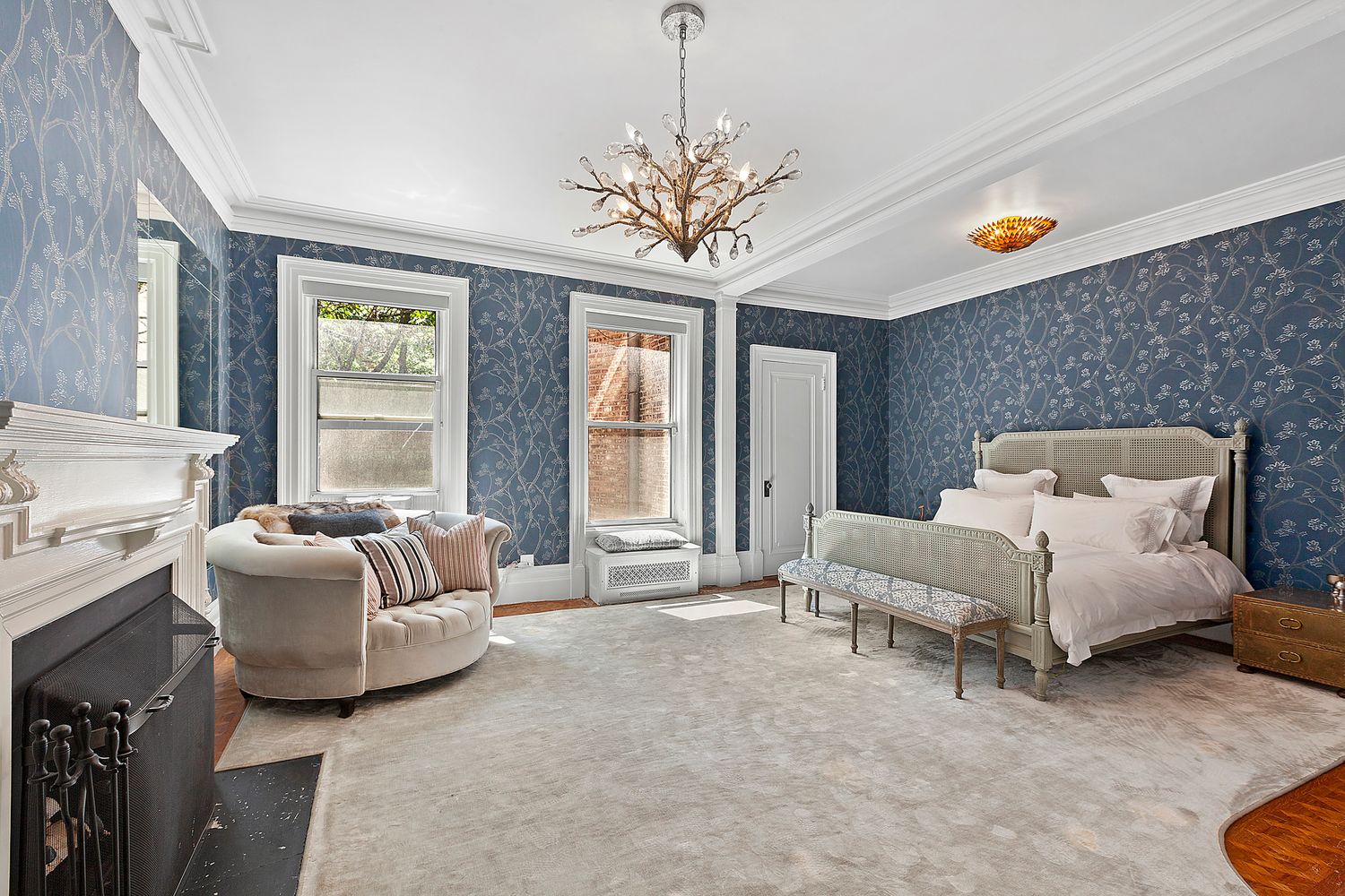 16 East 74th Street, Unit 4/5 Manhattan, NY 10021 - Photo 5 of 13 a living room with furniture and a chandelier