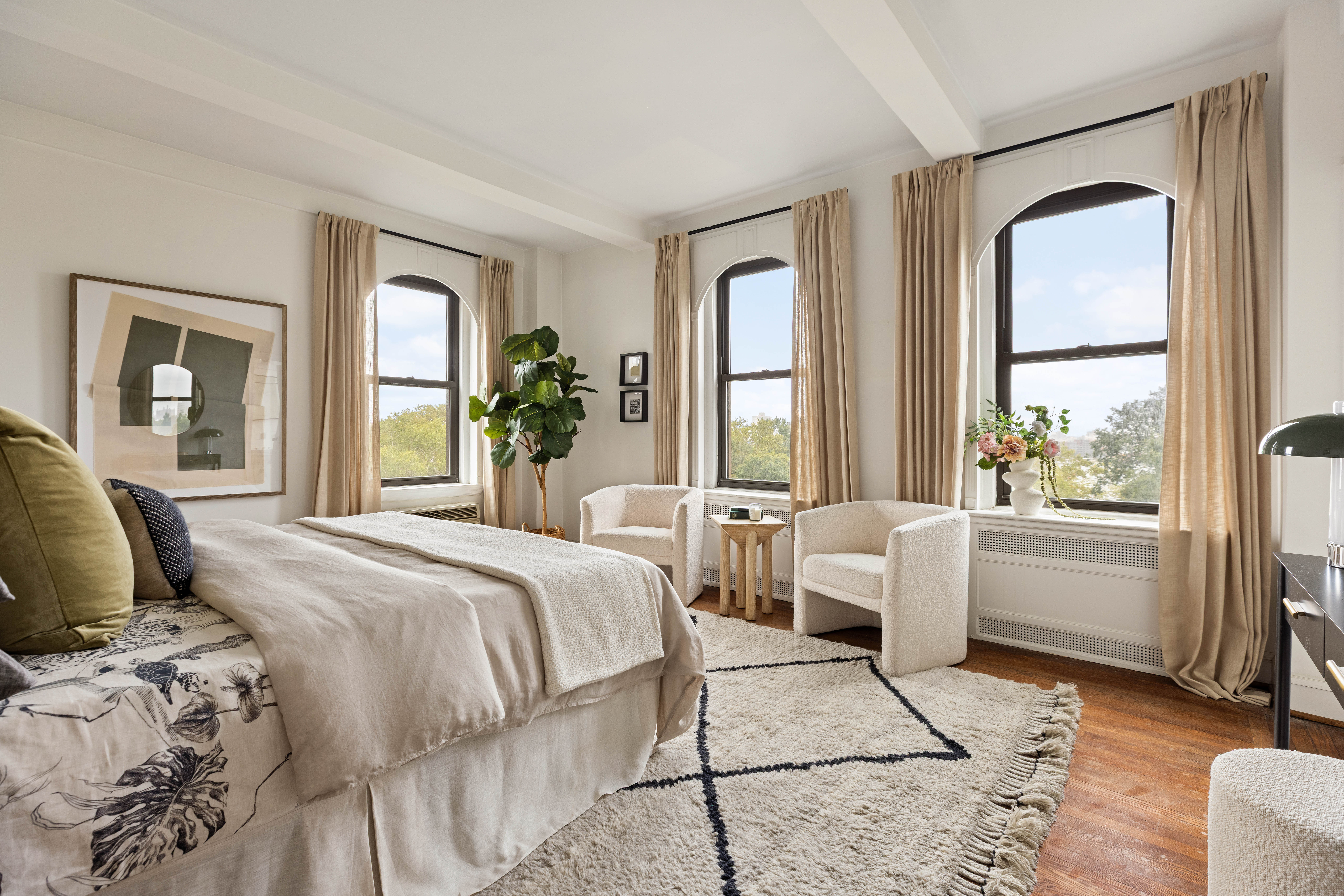 130 East End Avenue, Unit 8A Manhattan, NY 10028 - Photo 5 of 13 a bedroom with a bed and a large window