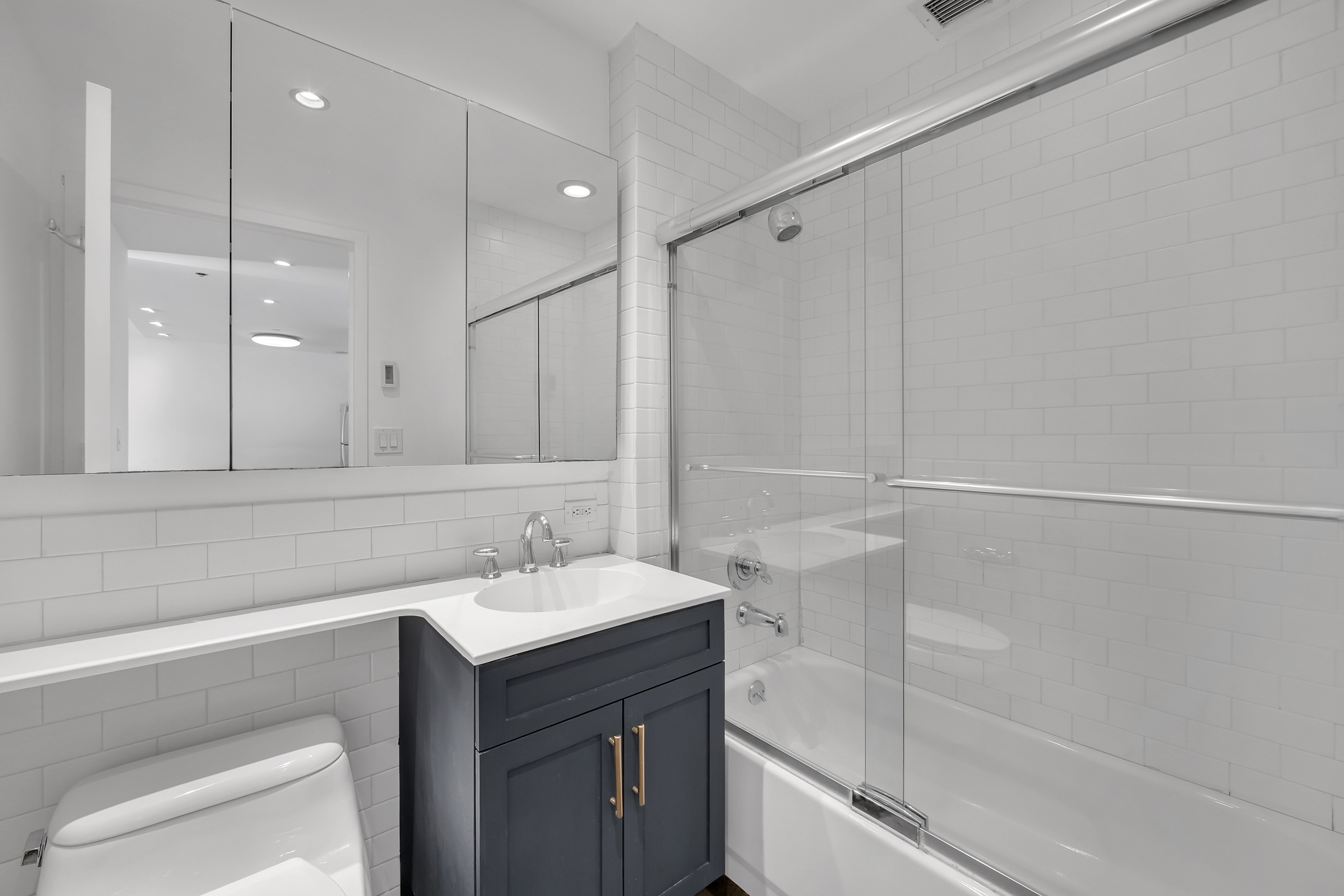 516 West 47th Street, Unit S1B Manhattan, NY 10036 - Photo 9 of 17 a bathroom with a sink and a mirror