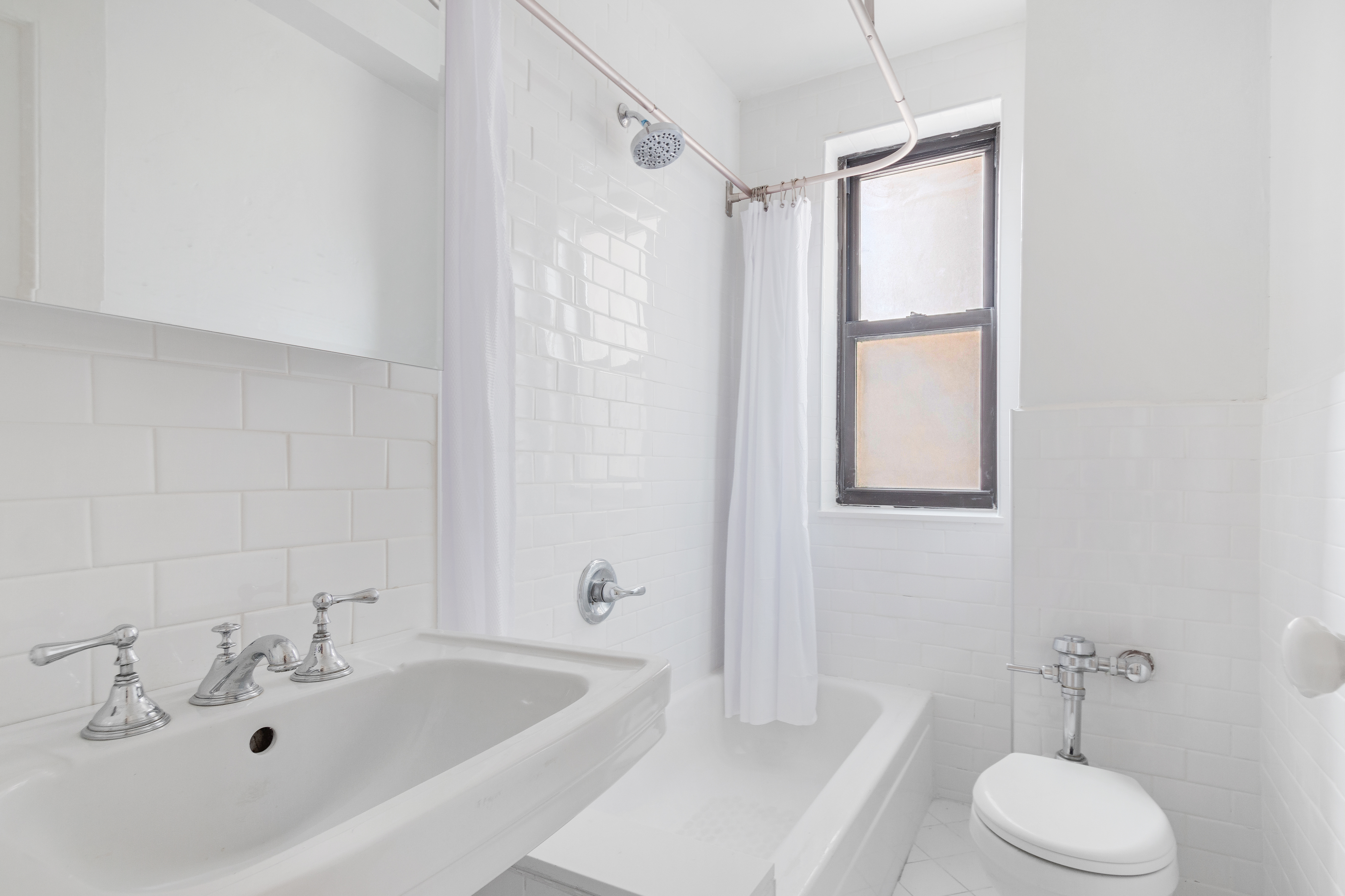 235 West End Avenue, Unit 8G Manhattan, NY 10023 - Photo 9 of 13 a bathroom with a sink and a bathtub