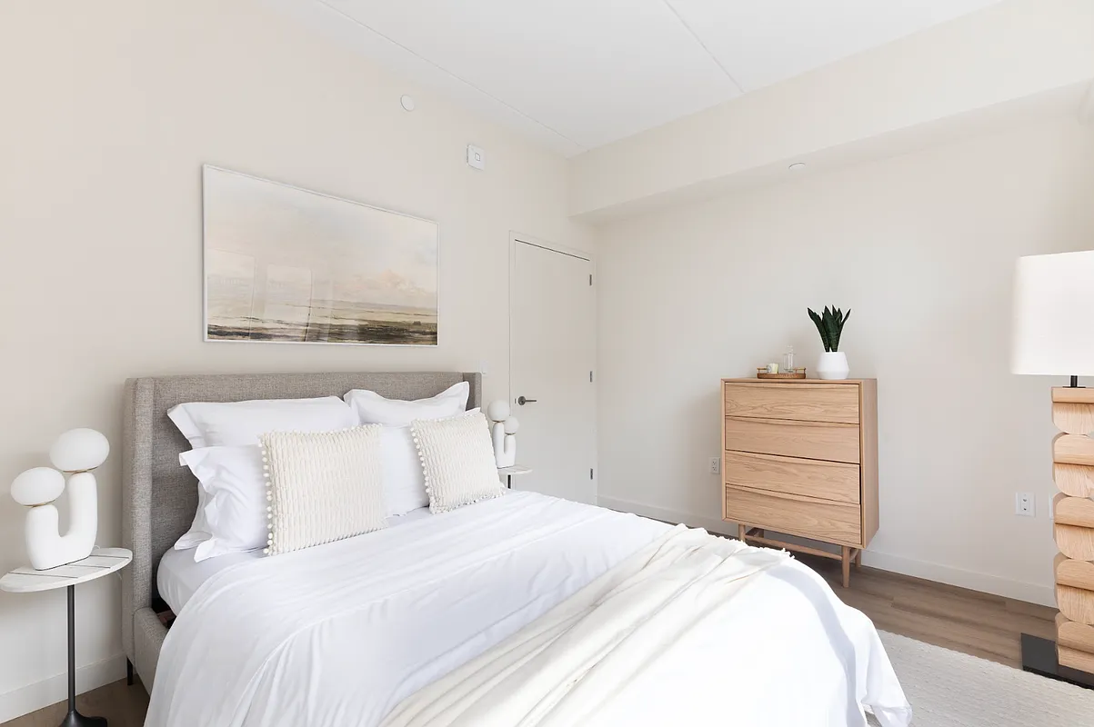 8 Palmetto Street, Unit 510 Brooklyn, NY 11221 - Photo 3 of 11 a bedroom with a bed and a dresser