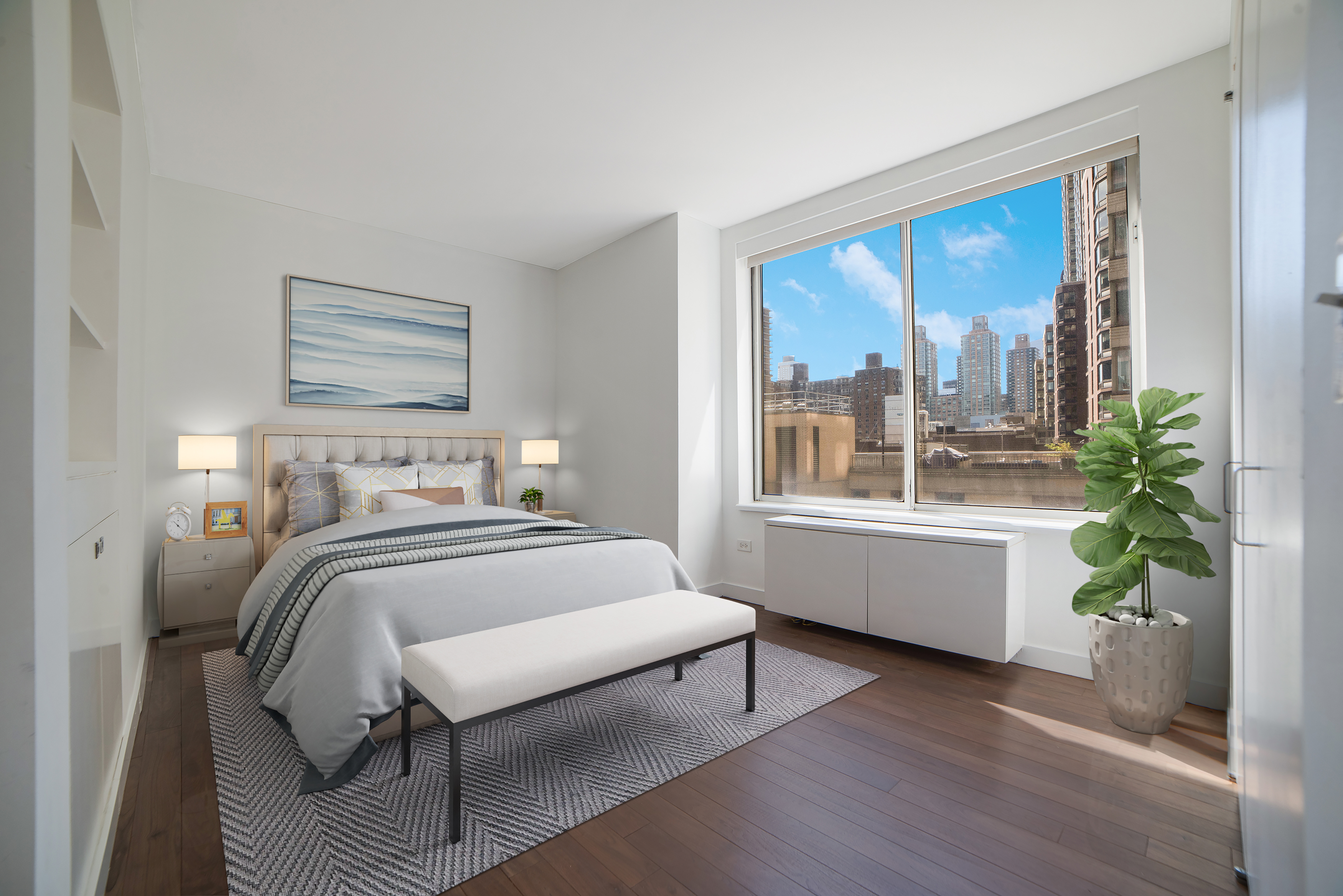 200 Riverside Boulevard, Unit 5EF Manhattan, NY 10069 - Photo 4 of 8 a bedroom with a large bed and a potted plant