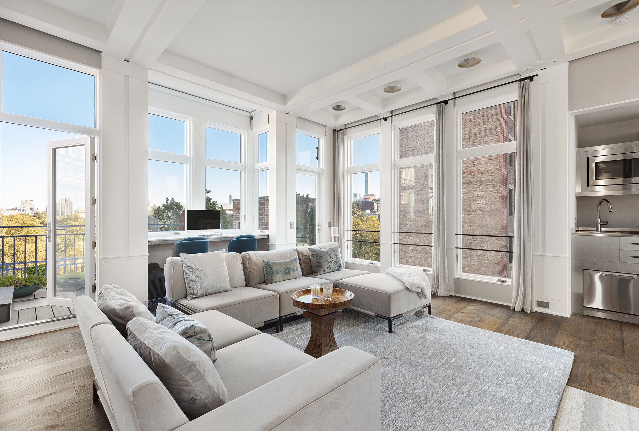 428 Columbus Avenue, Unit PH Manhattan, NY 10024 - Photo 18 of 21 a living room with furniture and a large window