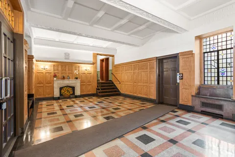 a bedroom with a bed and glass door